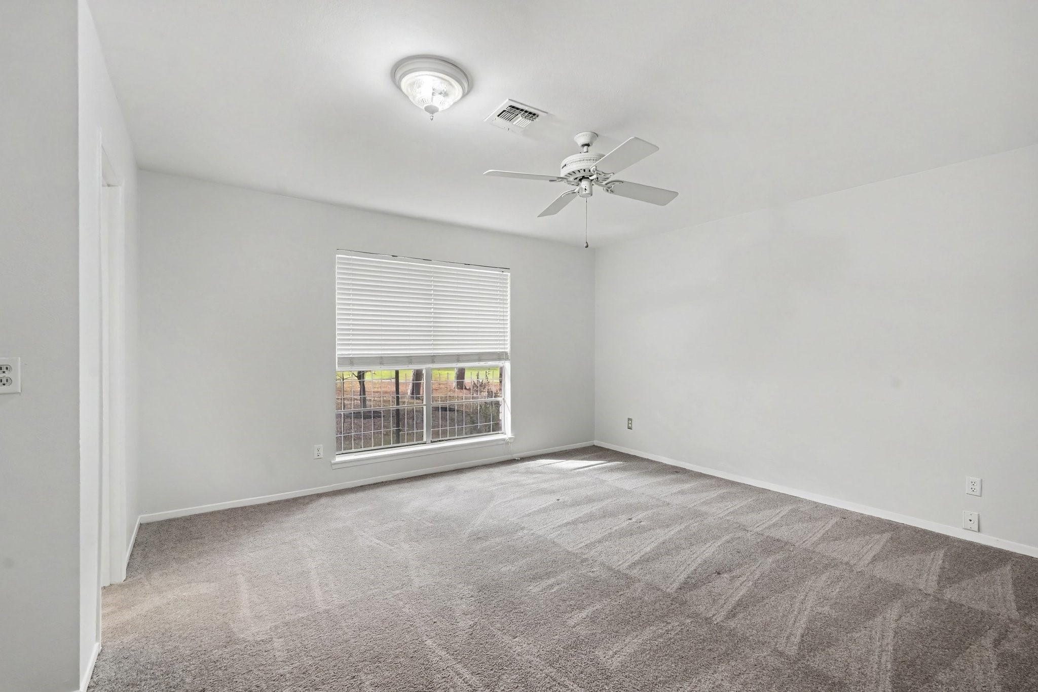 Welcome to the primary retreat! Fresh carpeting offers a soft, plush feel underfoot, creating the perfect, dreamy atmosphere to end your day.