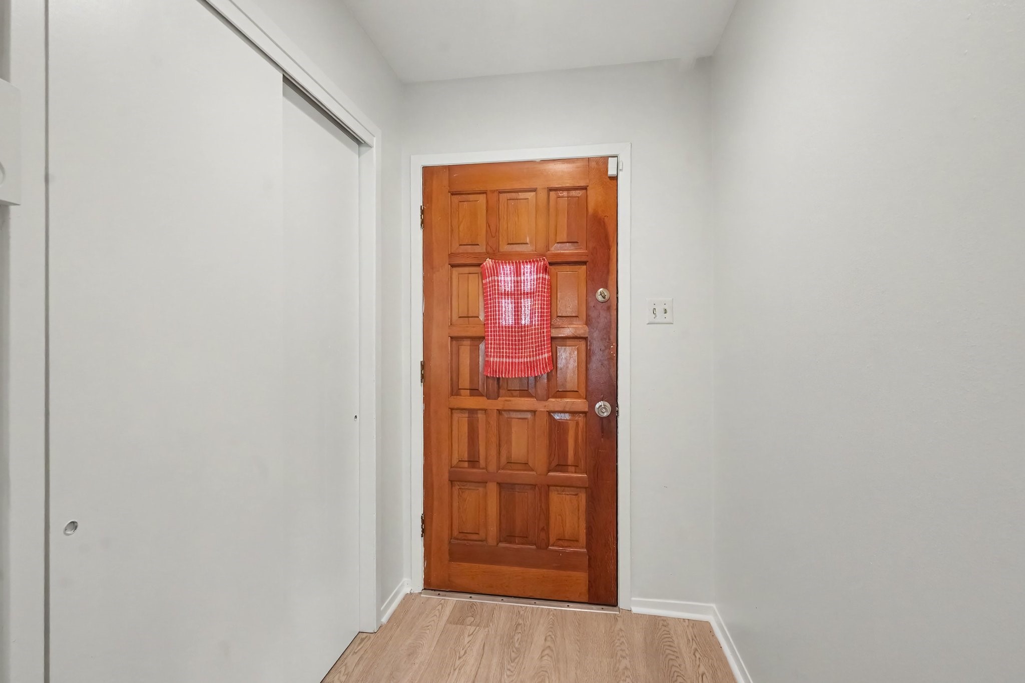 Step into a light and bright entryway featuring a spacious double closet for all your storage needs.