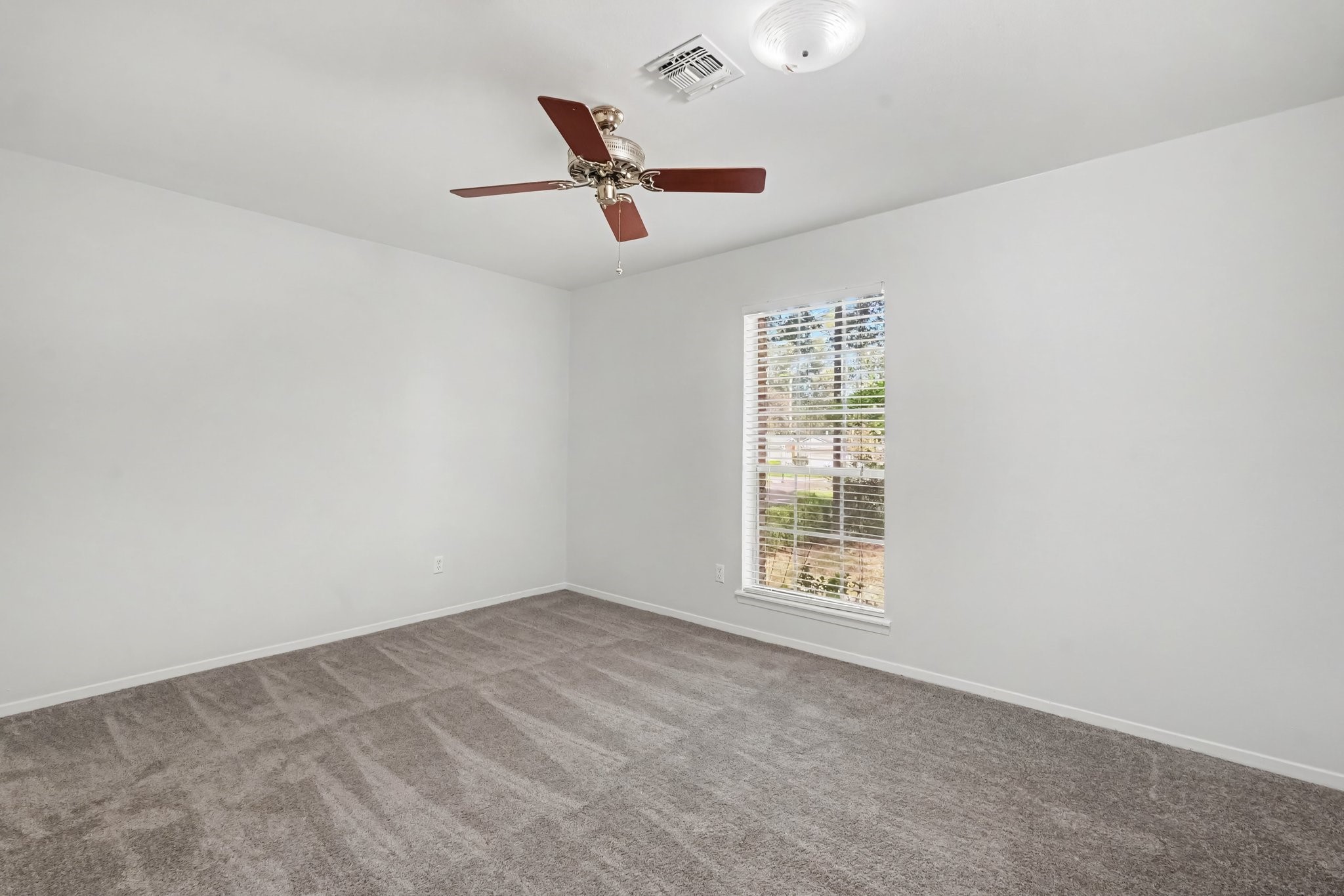 This home features one secondary bedroom, that could easily be a home office, guest room or workout space!