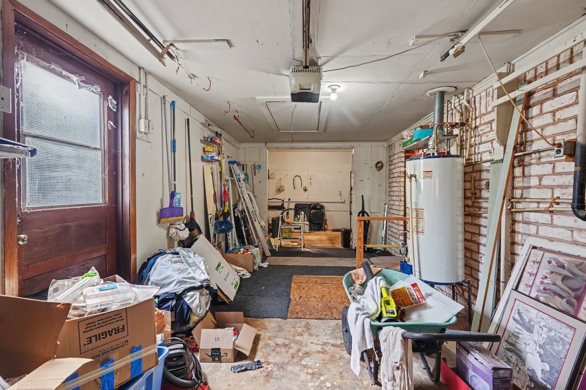 This spacious garage provides ample storage, complete with a convenient side-entry door for easy access.