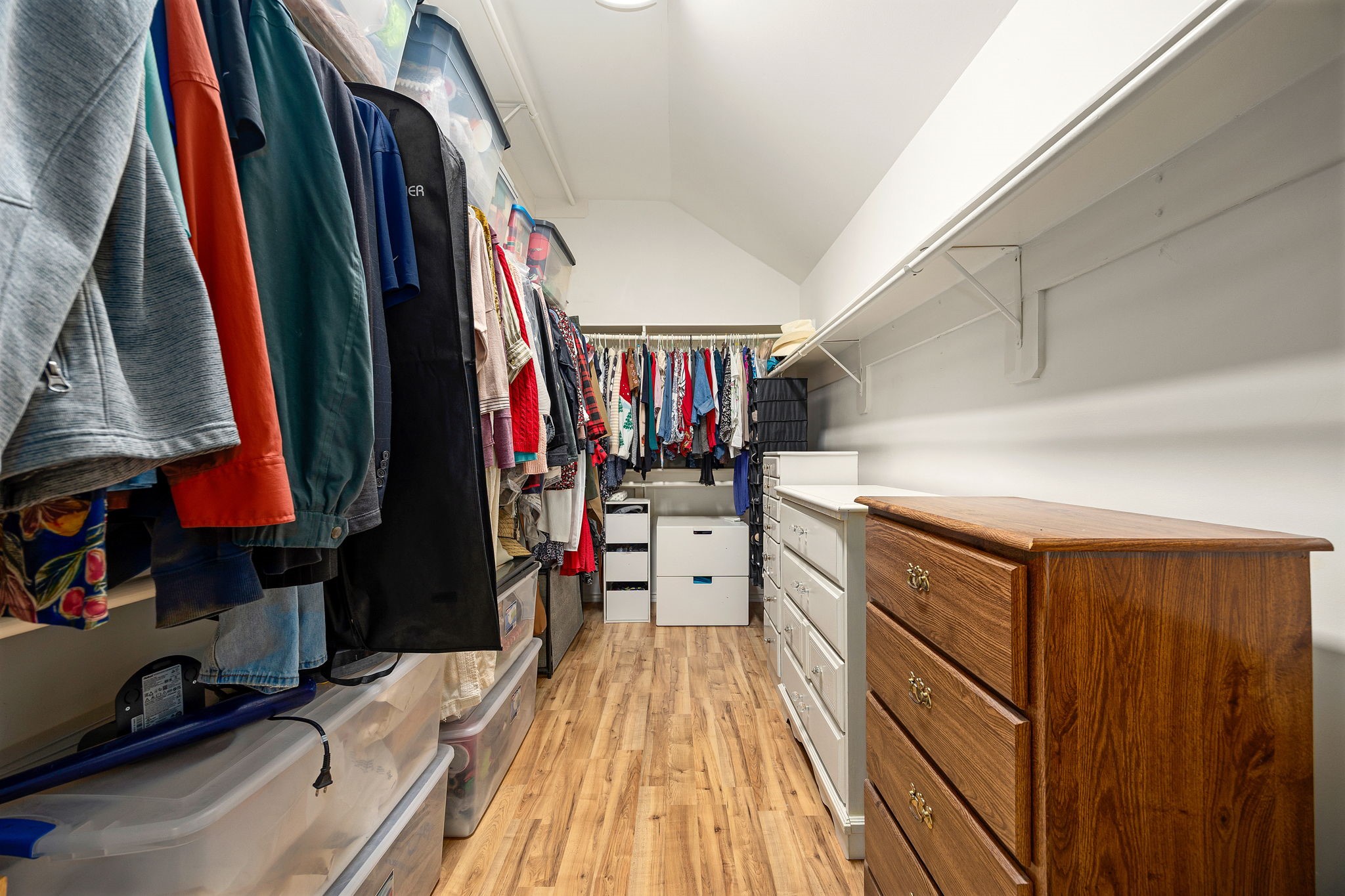 The primary suites walk-in closet offers generous space to keep everything organized and within reach.