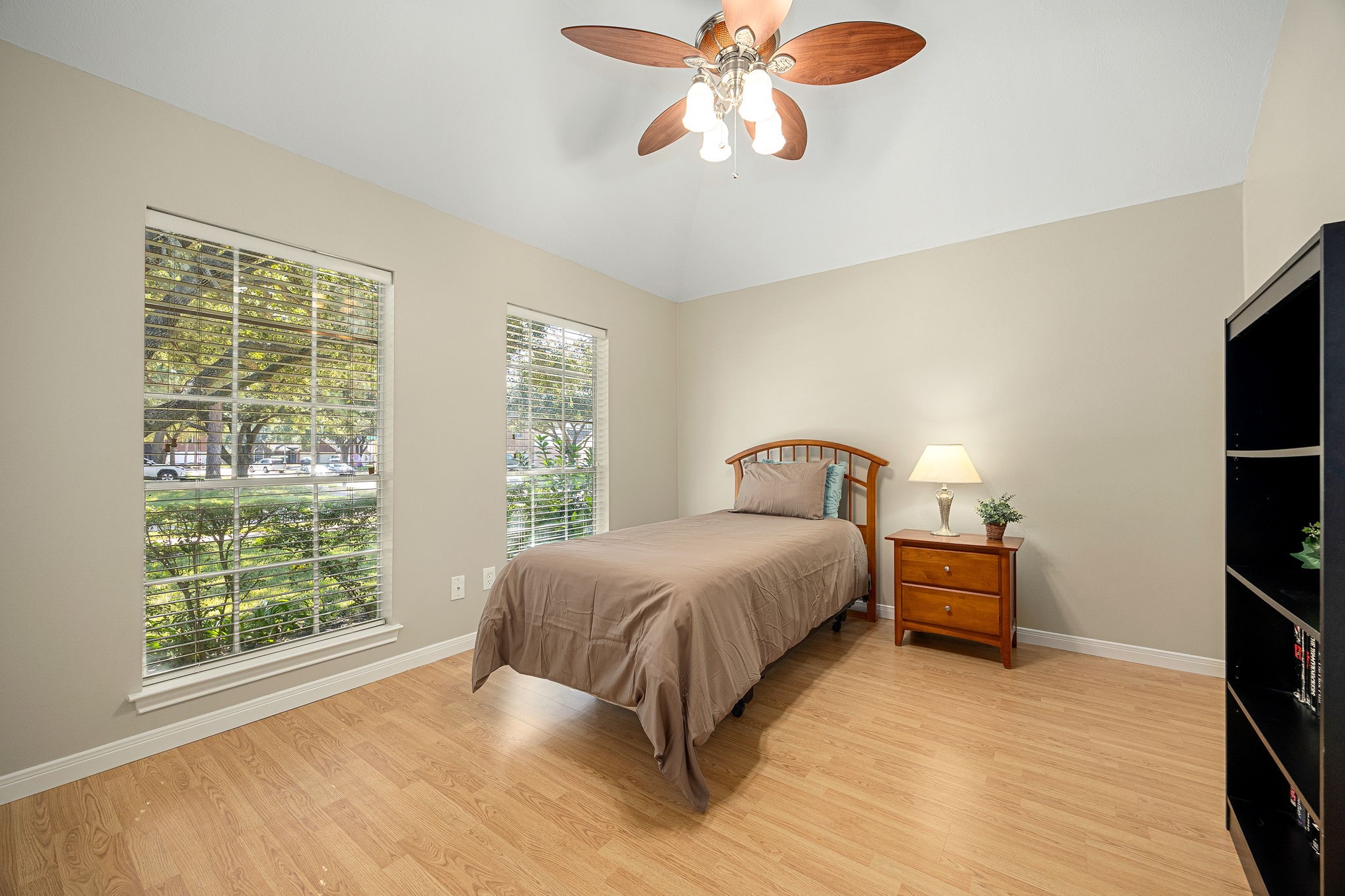 A secondary bedroom offers a bright, versatile layout, easily suited for a guest room, home gym, or active lifestyle space.