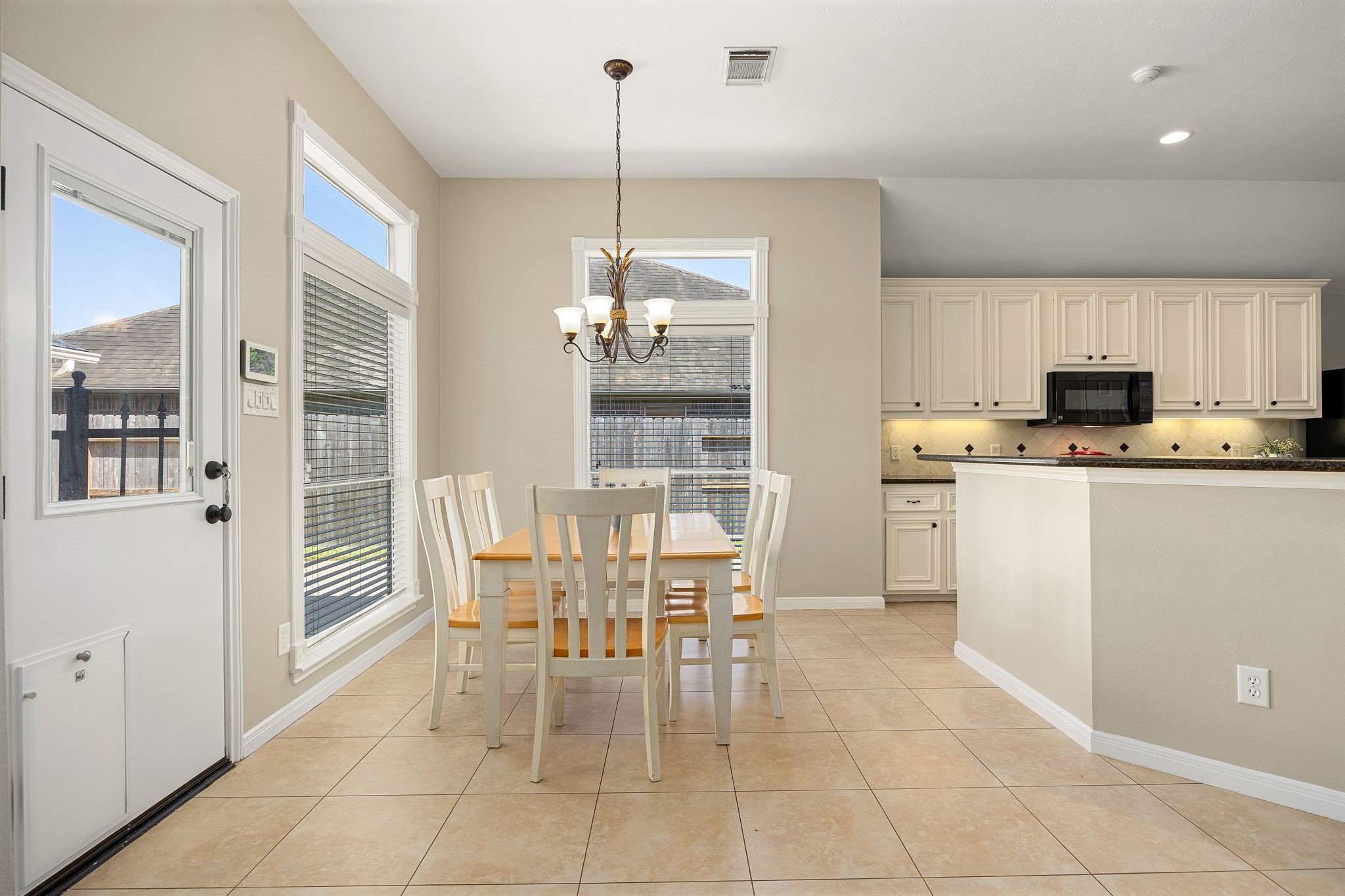 The breakfast area sits just off the kitchen, offering a sunny spot for casual dining with easy backyard access. The breakfast area sits just off the kitchen, offering a sunny spot for casual dining with easy backyard access.