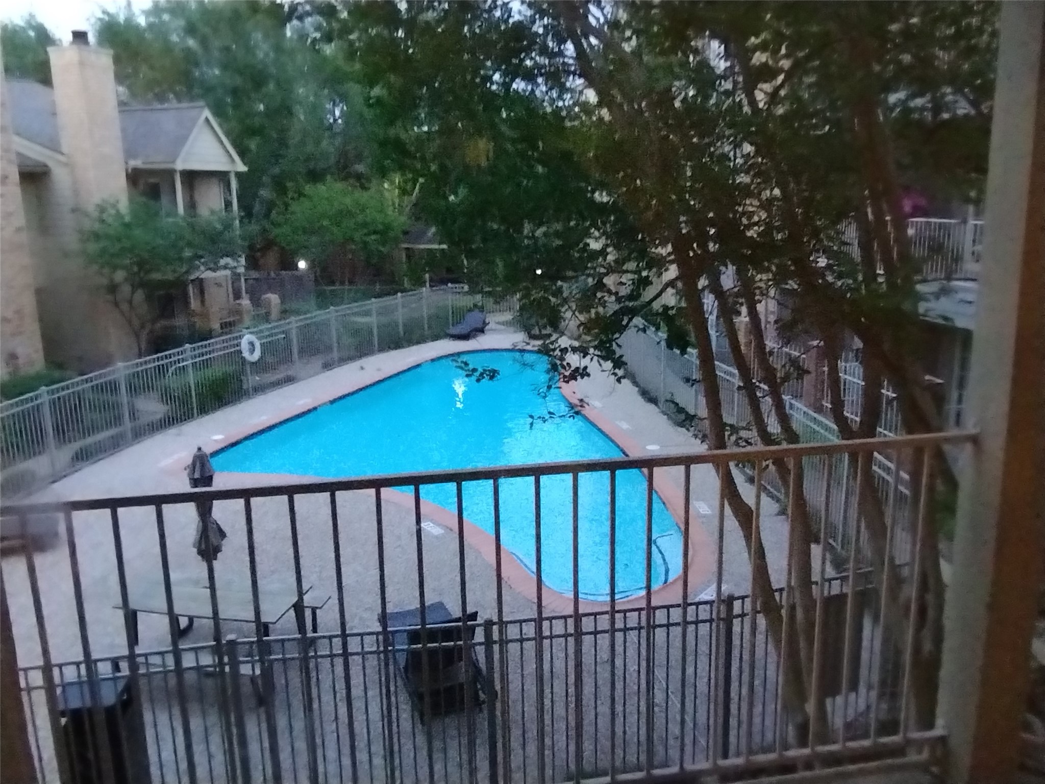 Here is the VIEW FROM THE COVERED BALCONY/TERRACE at twilight.  Come see what 11201 Lynbrook Dr. has to offer!