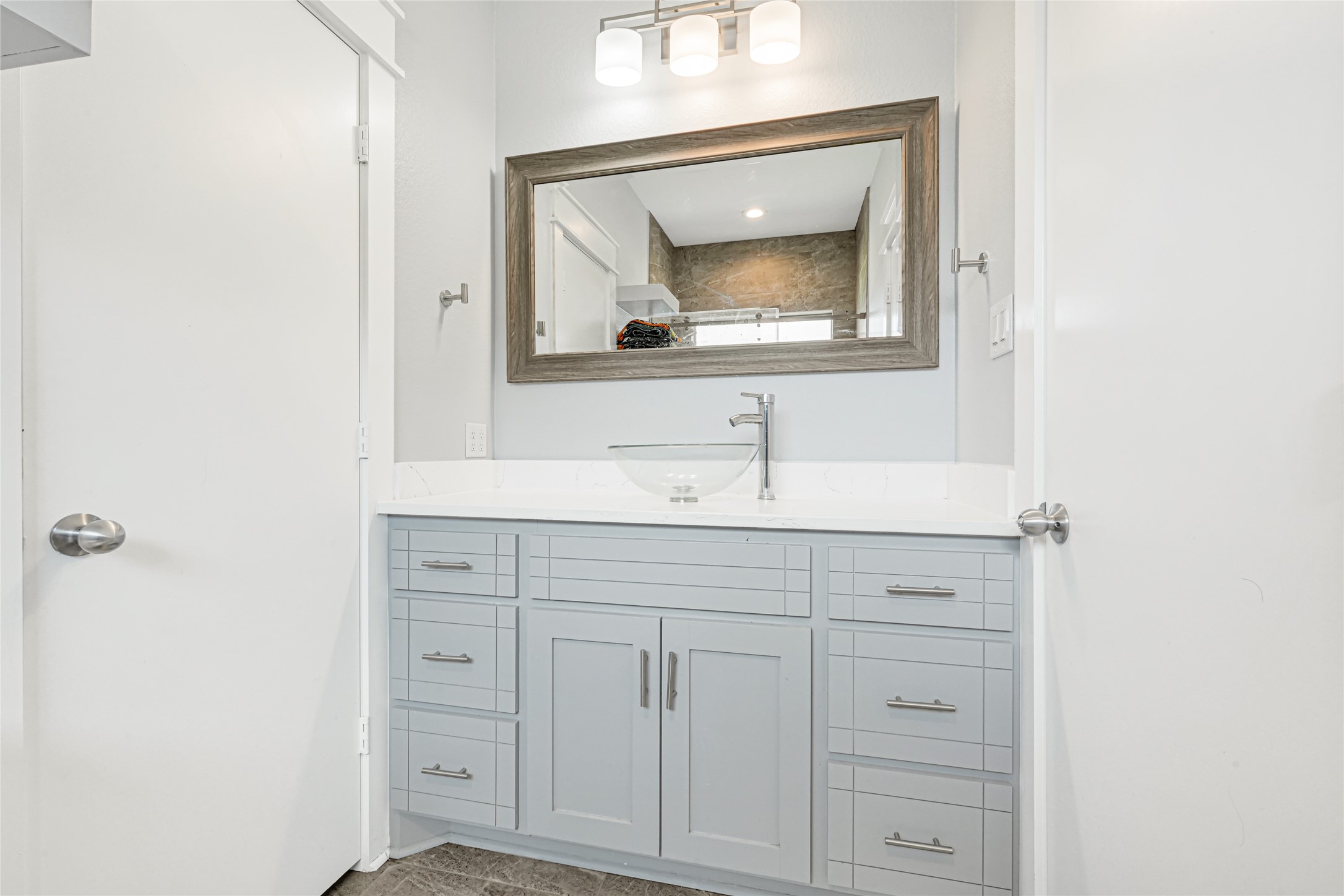 Comfortable bedroom with wood flooring, a ceiling fan, and space for additional furnishings.
