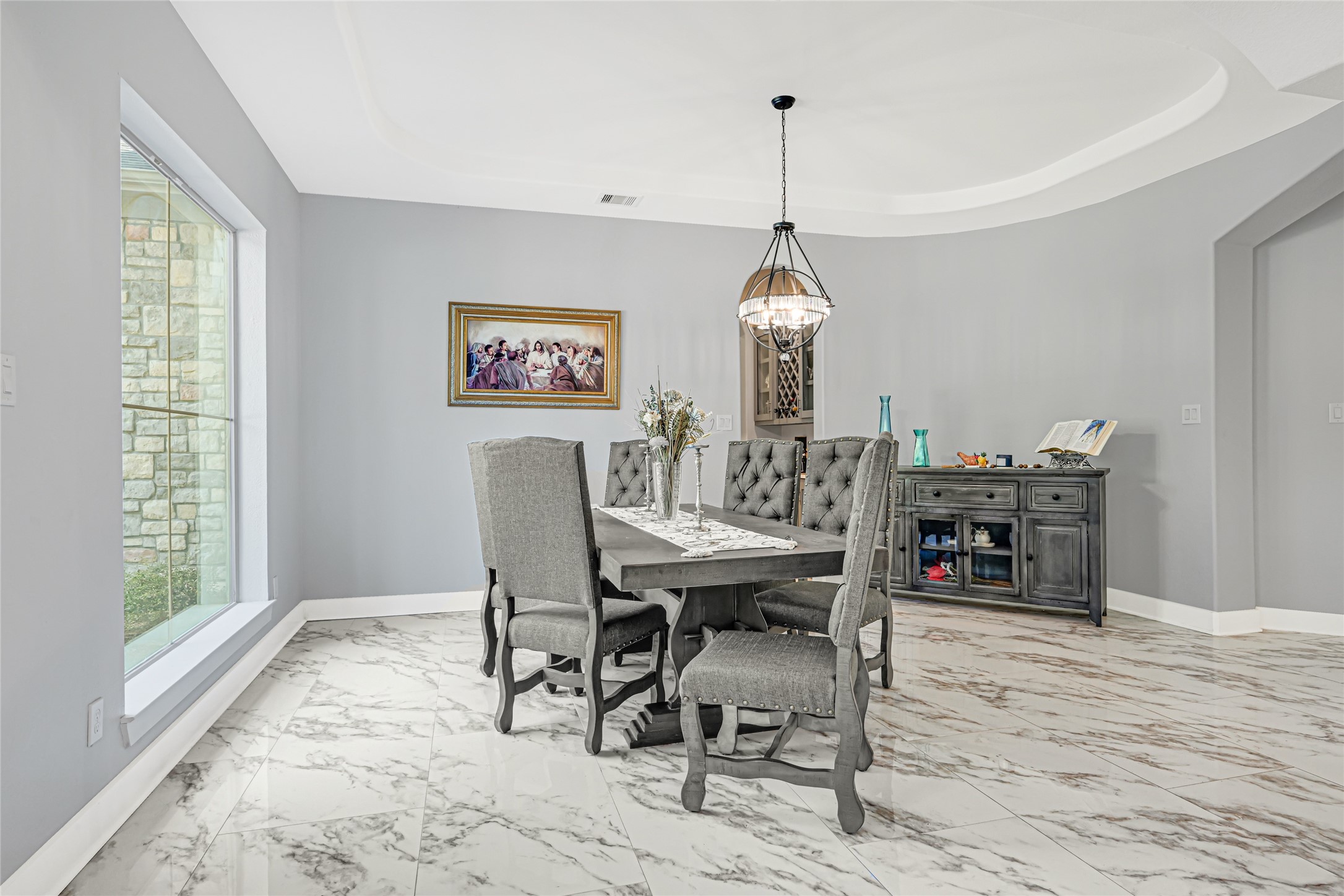 Light-filled formal dining room provides an inviting setting for gatherings.