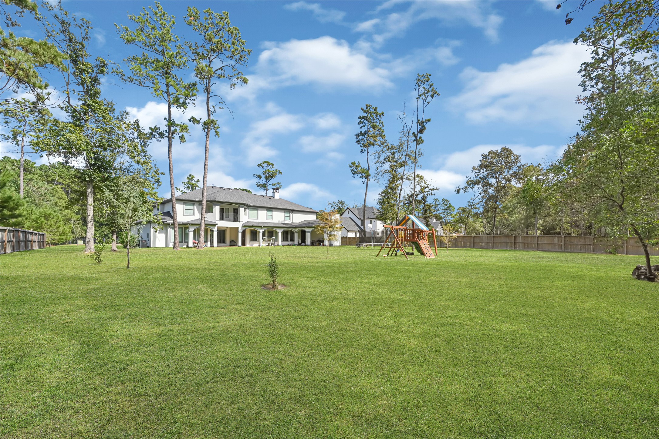 Another view of the generous backyard and outdoor setting.