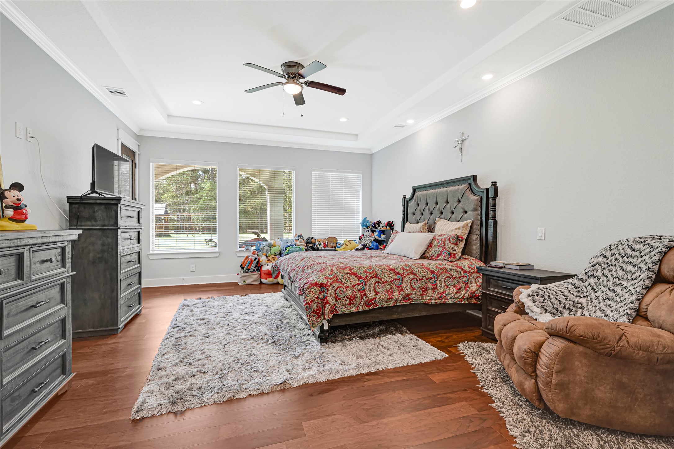 An alternate bedroom view highlights generous space for a bed and additional seating.