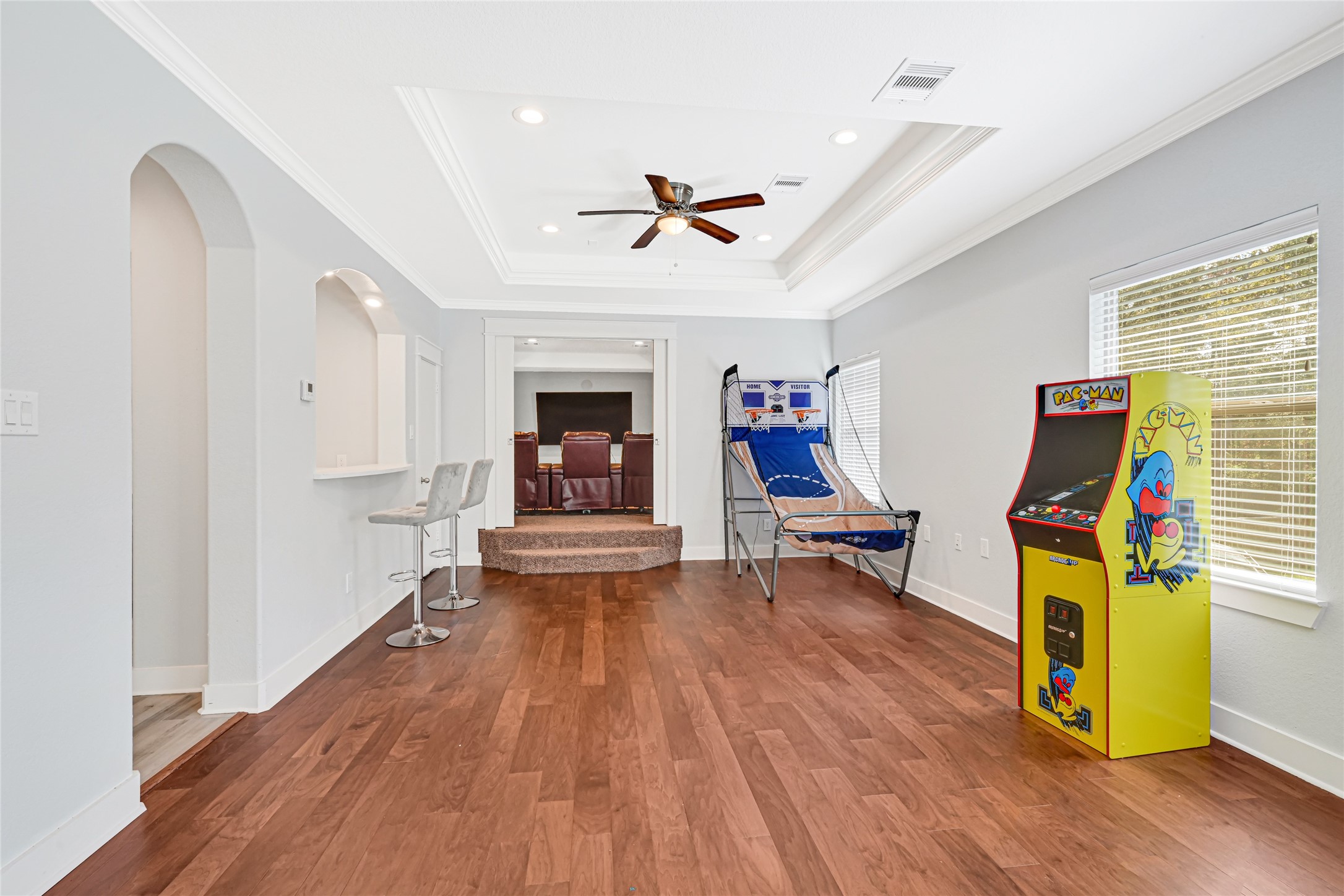 An additional angle of the upstairs game room showcases its generous layout for recreation and entertaining.
