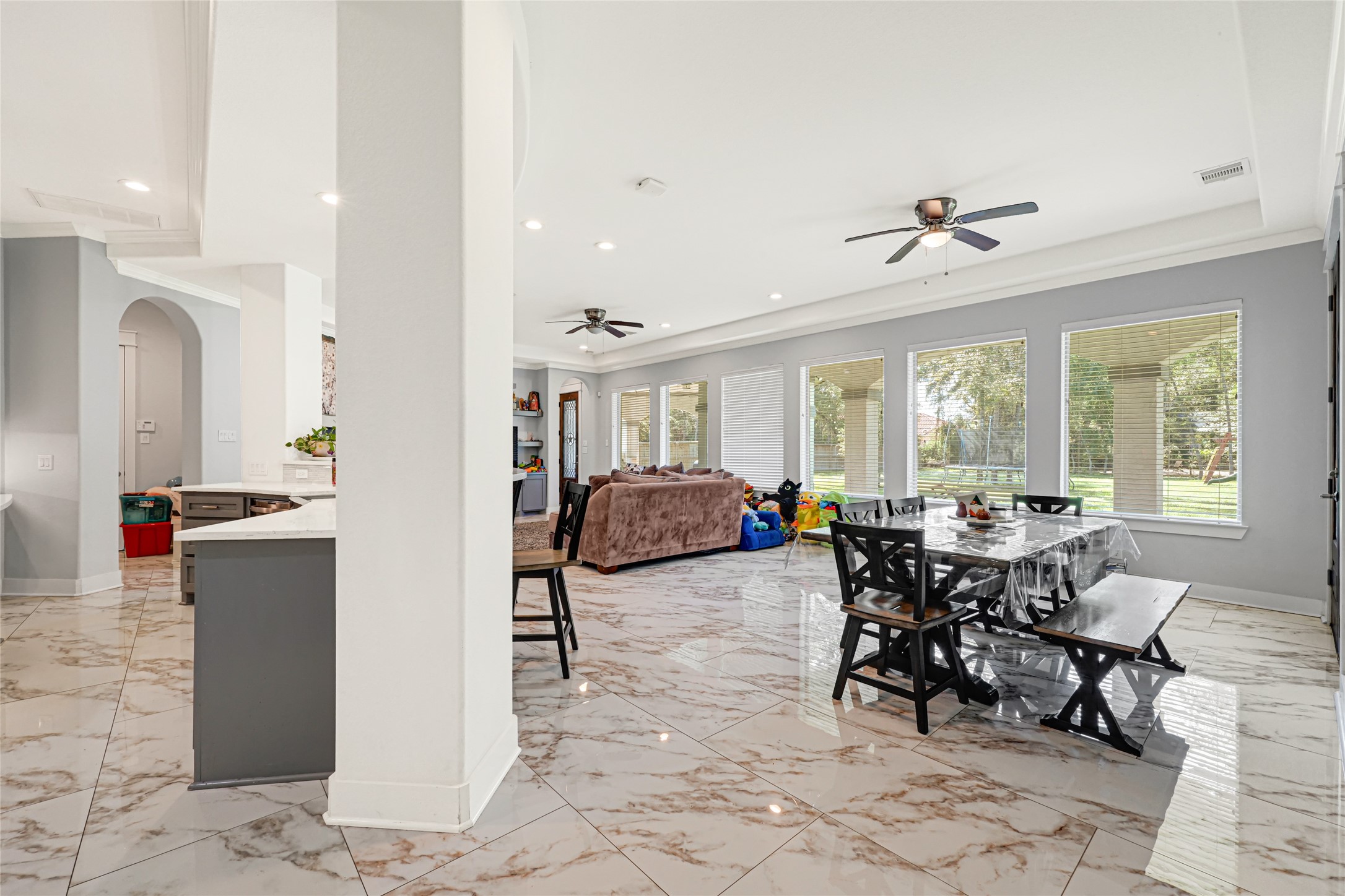 Connected kitchen, breakfast, and family room spaces offer a comfortable layout for everyday living and entertaining.