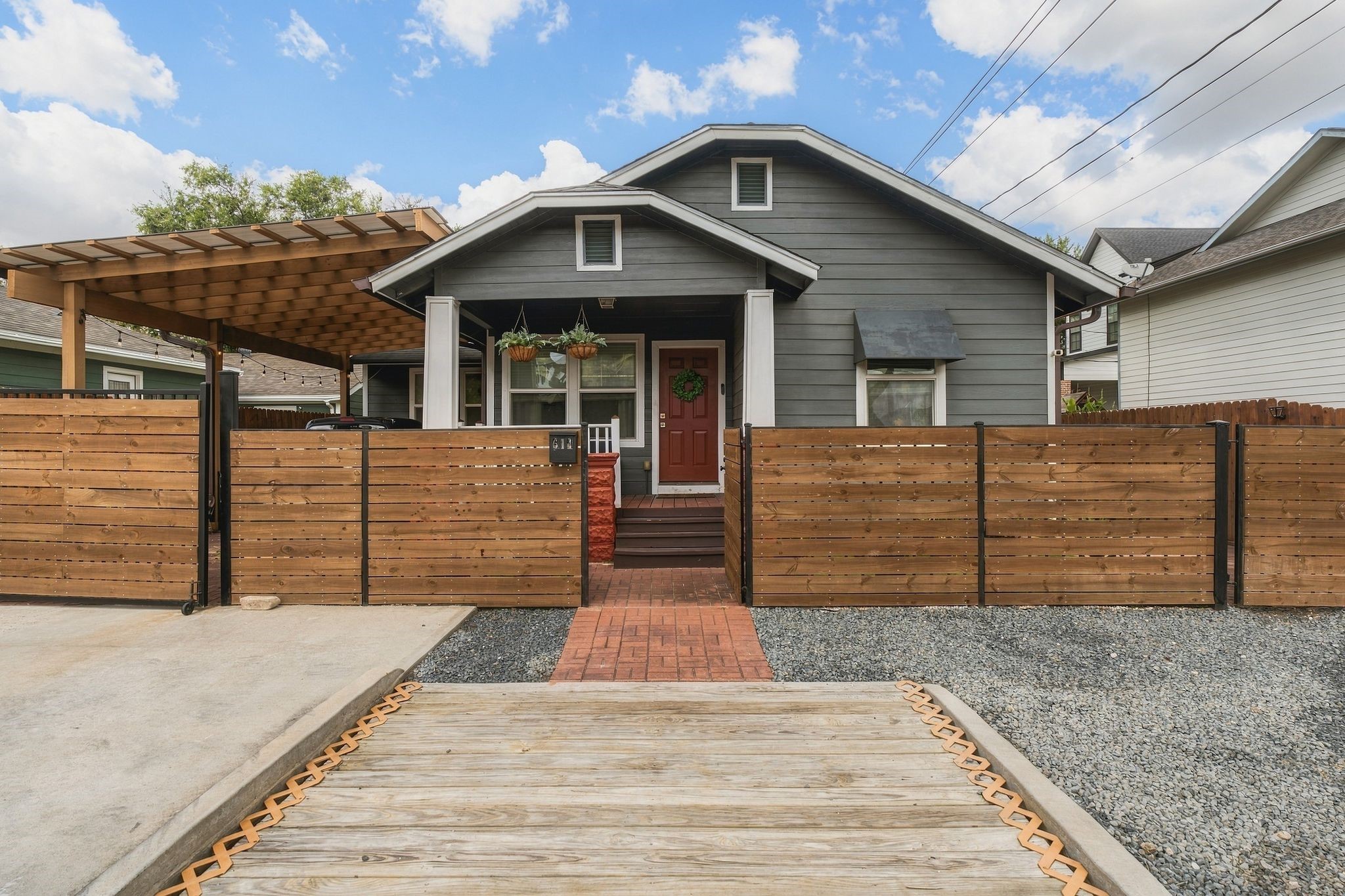 Charming 1925 bungalow in Houston's Brooke Smith neighborhood, featuring a fully fenced front yard, pedestrian gate, gated driveway, and additional off-street parking. An inviting opportunity to enjoy the Greater Heights lifestyle!