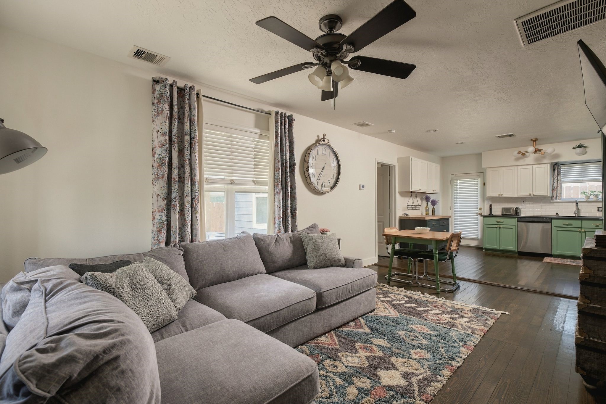 Open-concept living and dining spaces flow seamlessly into the kitchen, creating a comfortable layout for everyday living and entertaining in this charming Houston Heights-area home.