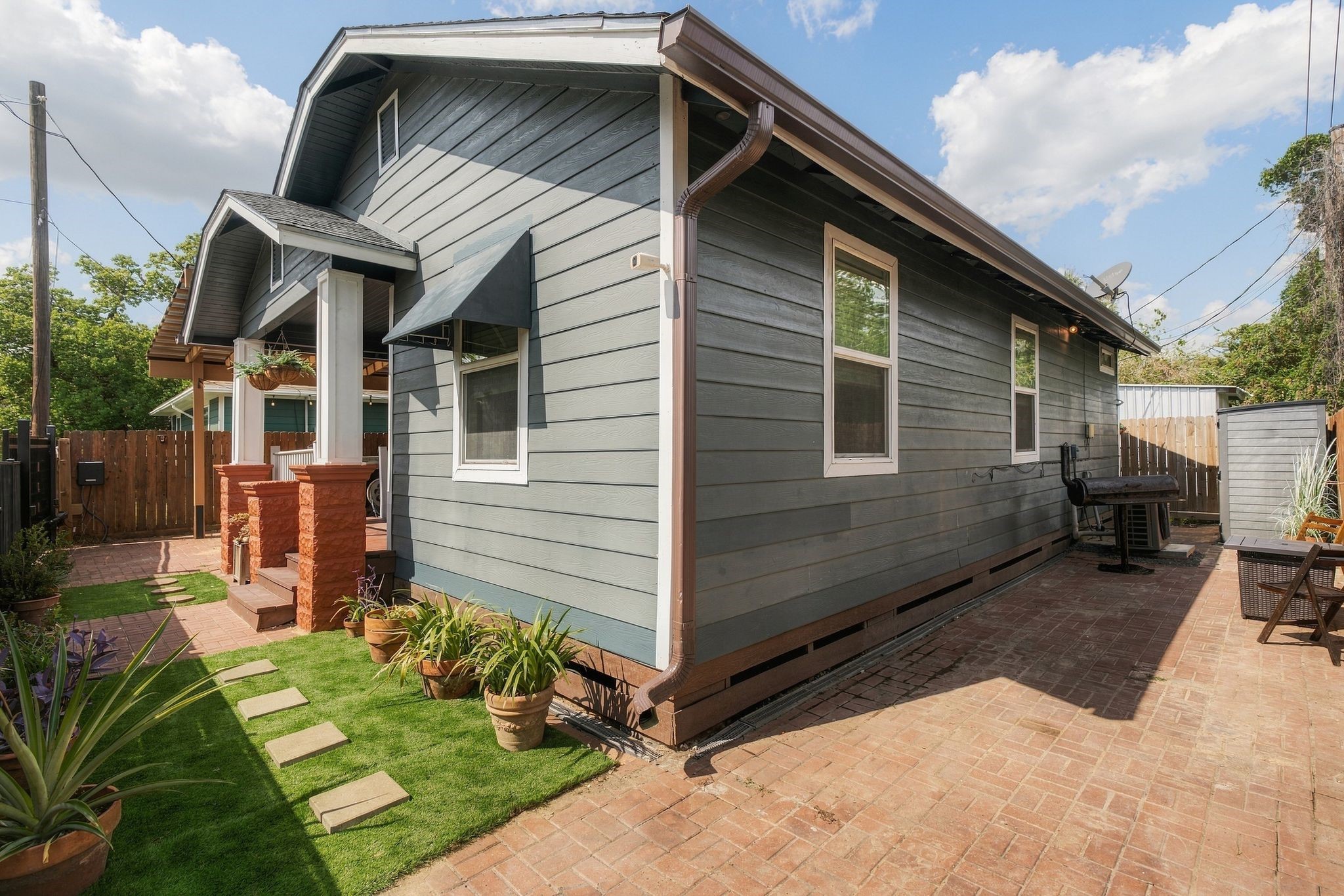 Private, fenced side yard with generous patio space and room to create additional green space. Extend the existing front-yard turf or add landscaping to make this outdoor area your own.
