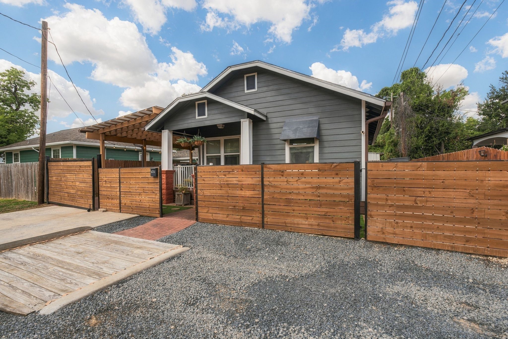 A standout feature for Inner Loop living! Additional front parking pad complements the gated double-wide driveway and covered carport, providing convenient off-street parking for multiple vehicles.