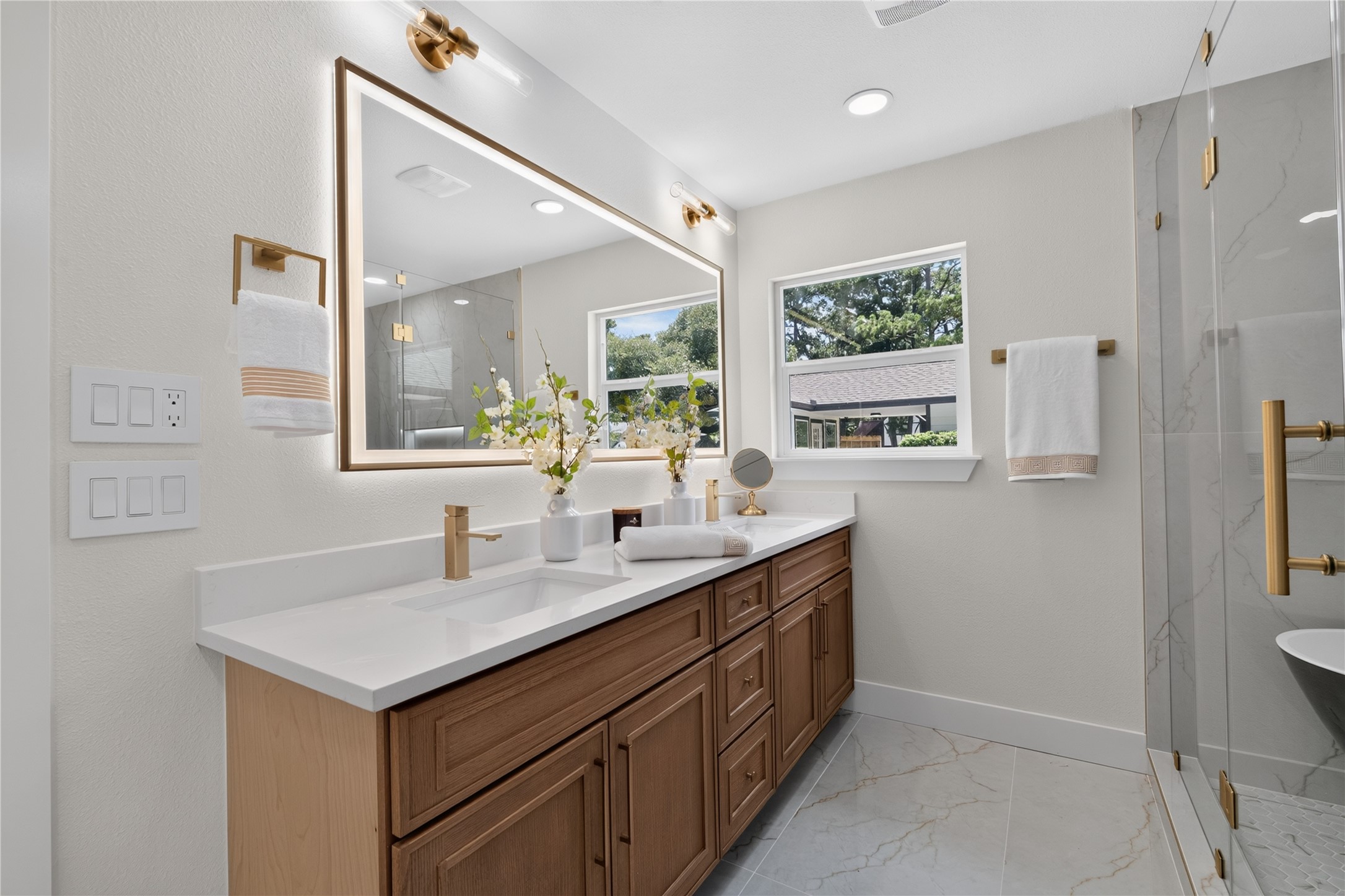 Large primary bathroom with elegant tub/shower combo