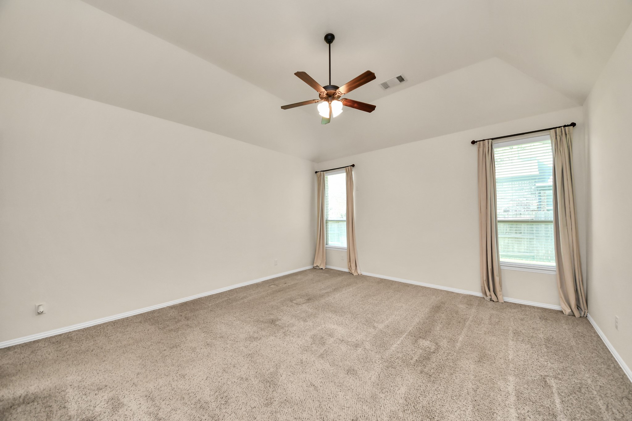 Photos include both previously furnished rooms and the homes current vacant condition to help buyers visualize the space and layout.