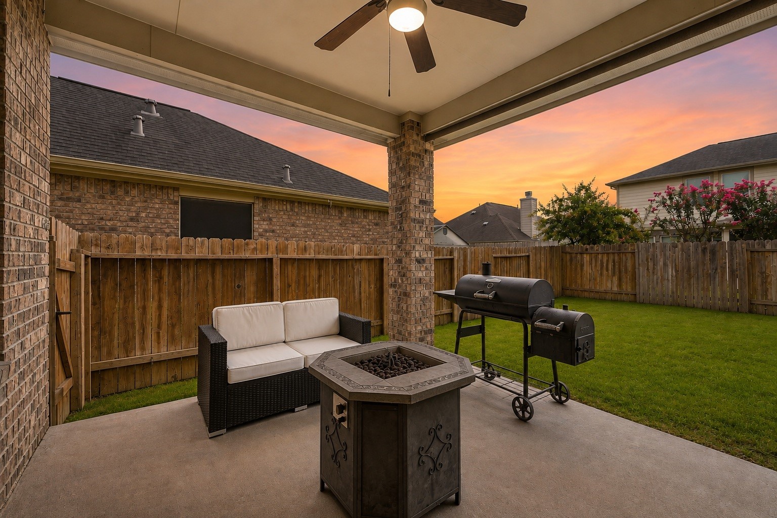 This covered back porch delivers the ideal setting for year-round indoor-outdoor living. Designed with a sheltered ceiling fan and generous floor space for outdoor dining or a barbecue setup.