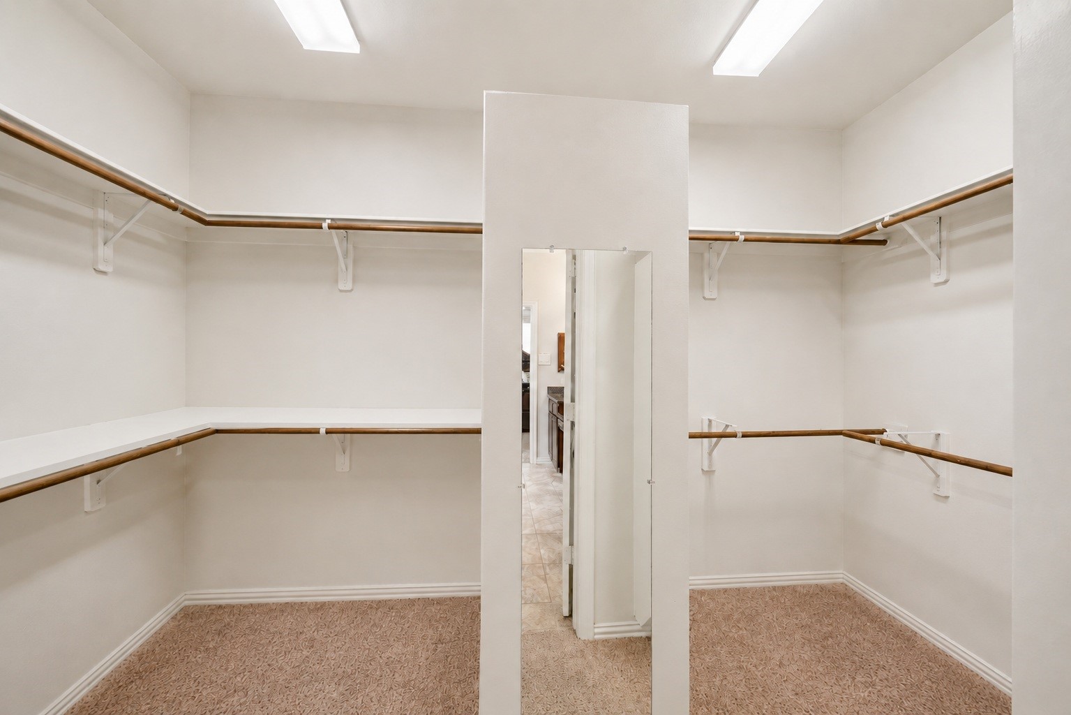 This impressive primary closet offers generous square footage and a smart layout tailored for two.