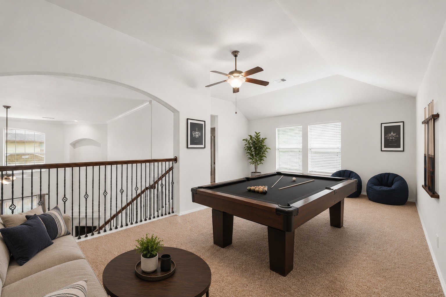 Virtually Staged: Step up to this expansive upper-level game room or secondary living area, offering incredible flexibility for entertainment, play, or a quiet home office.