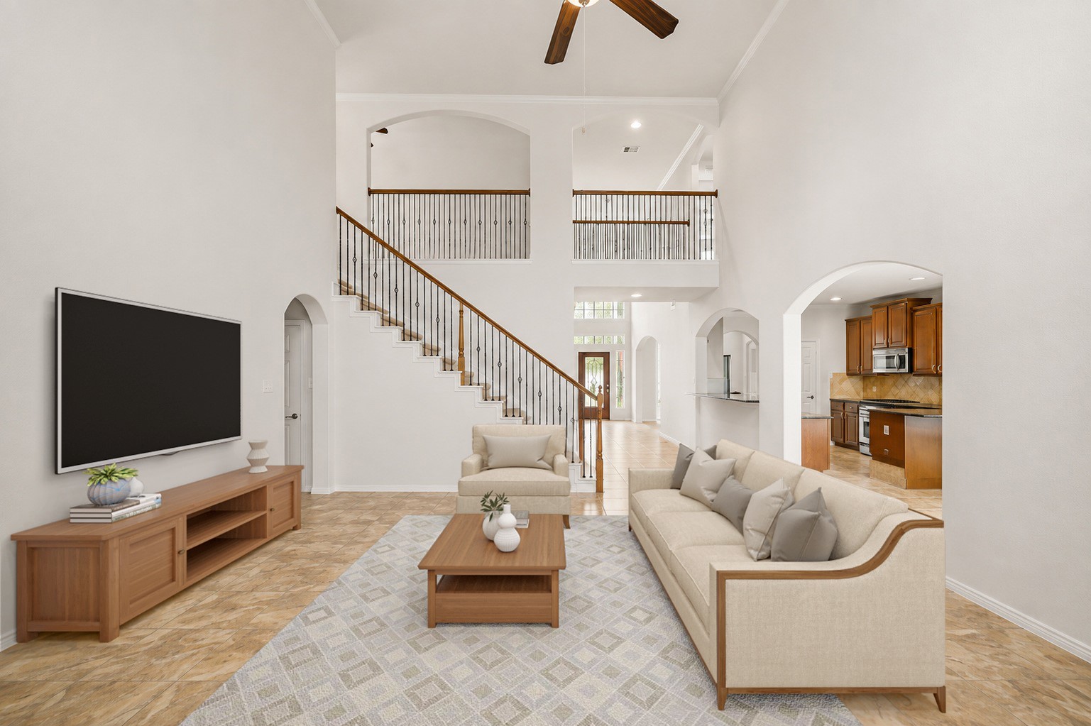 Virtually Staged: This expansive two-story family room features towering ceilings, overhead ceiling fans, and clear sightlines throughout the main floor.