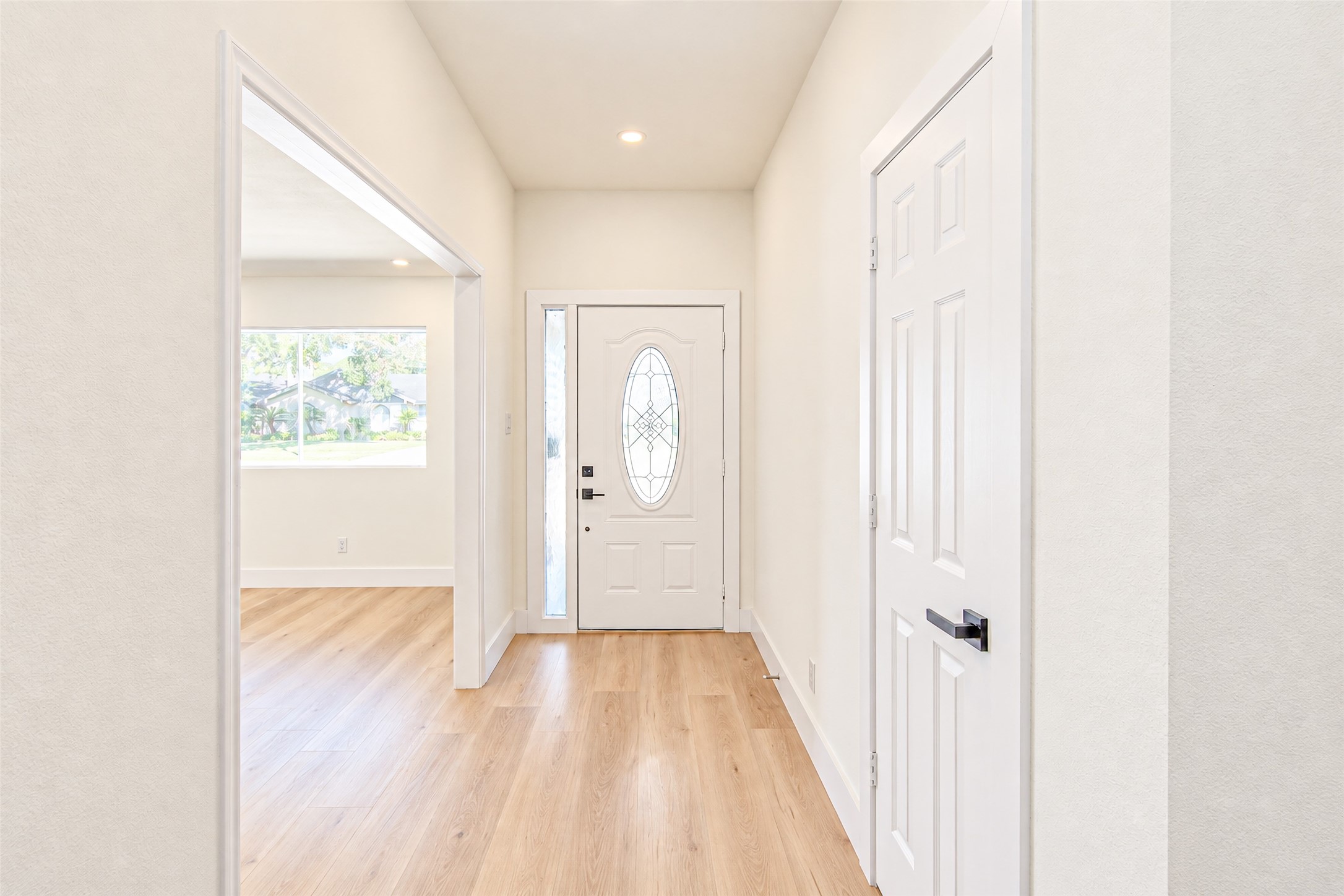 Experience elegance as you enter through a beautifully crafted front door, complemented by sleek hardwood floors that set an inviting tone for the entire home.