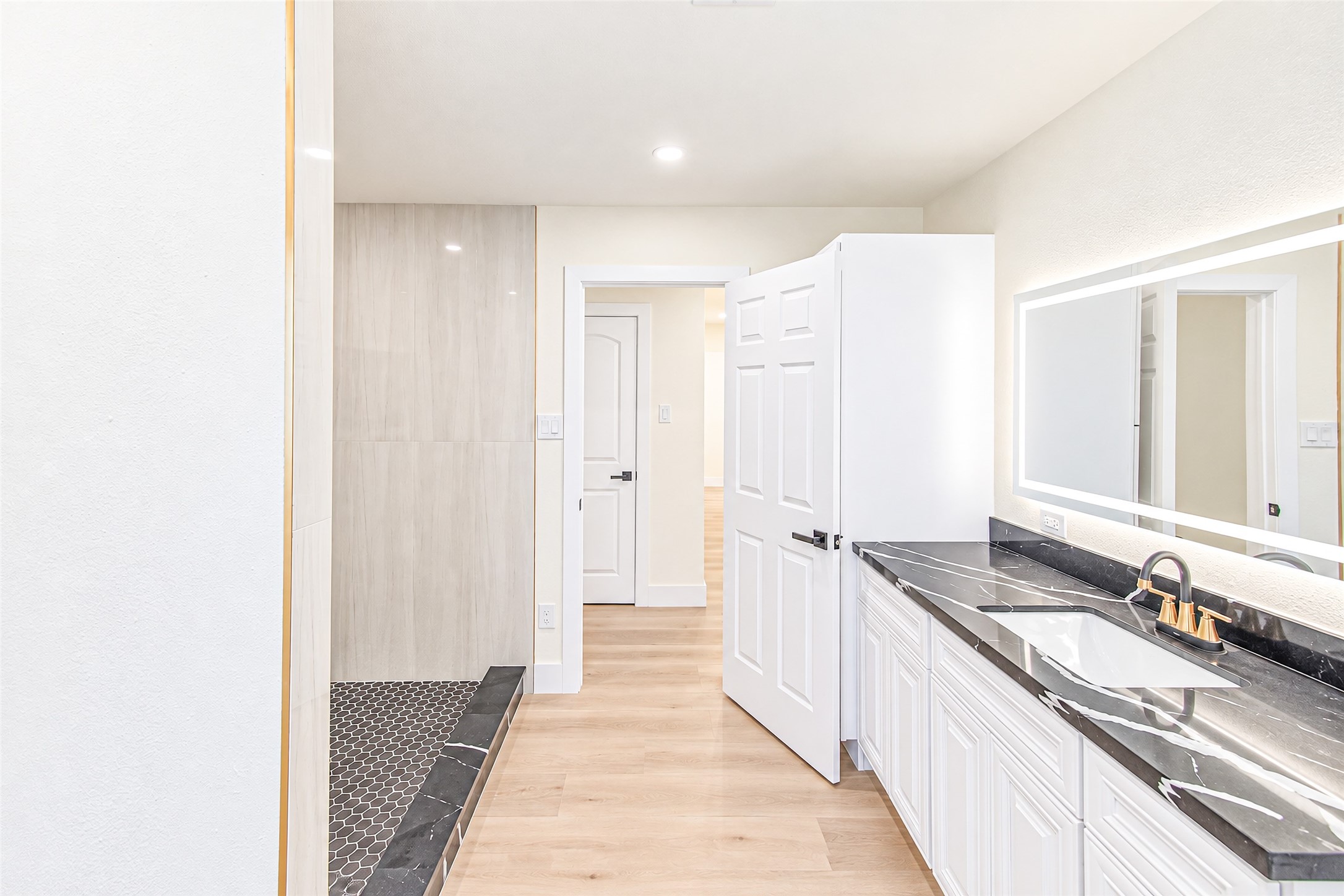Experience convenience and style in this elegant Jack and Jill bathroom, featuring sleek modern finishes and dual access for seamless shared living.