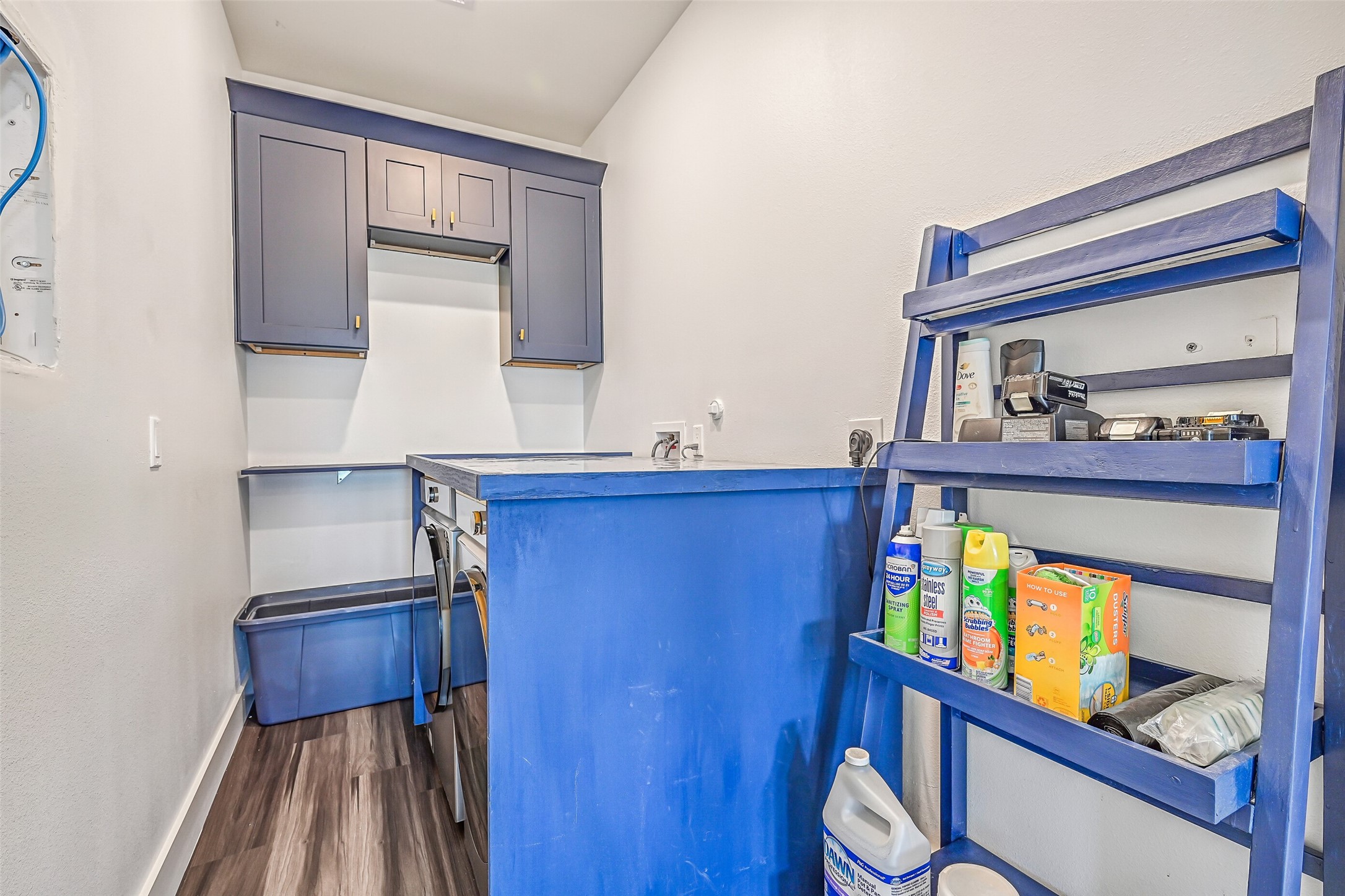 The laundry room is thoughtfully situated between the two bedrooms, offering easy access and added convenience.
