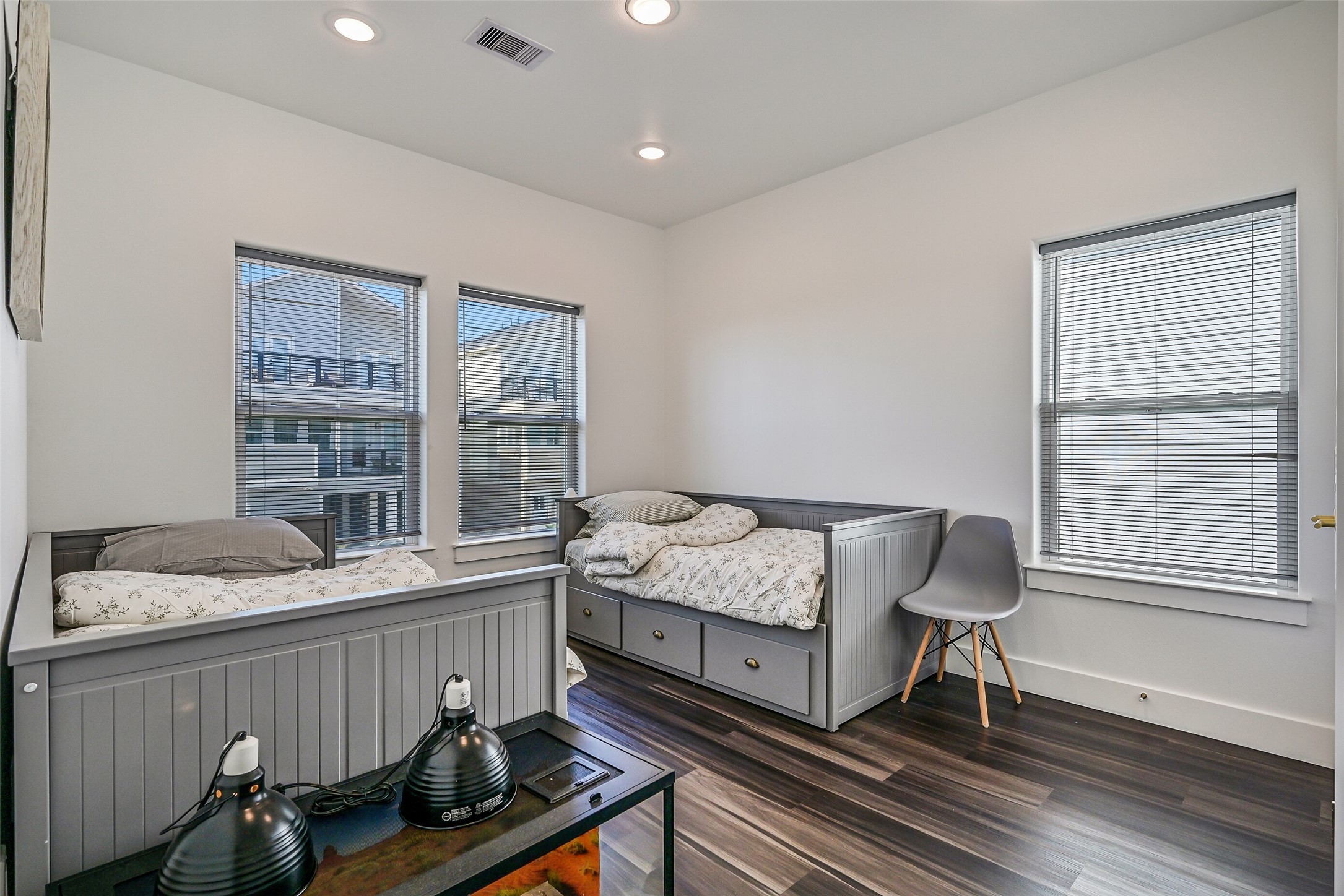 The first of two bedrooms youll find is this spacious and inviting guest bedroom.