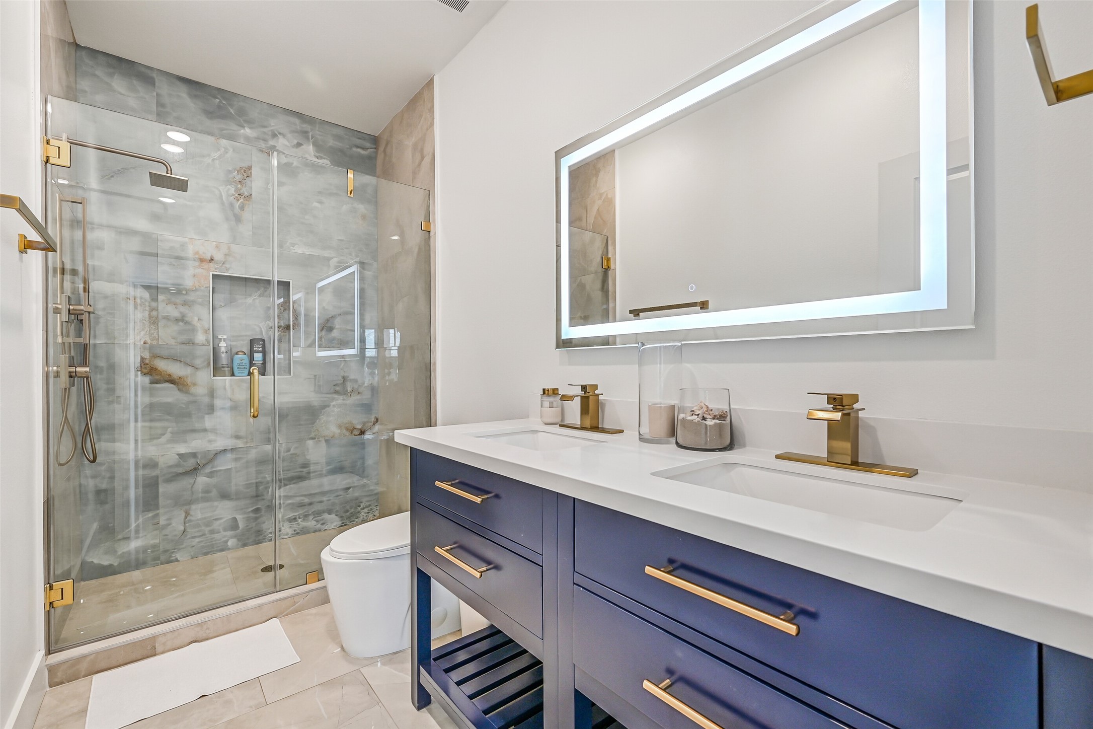 Down the hall, youll find two bathrooms, each thoughtfully located next to a bedroom for easy access.