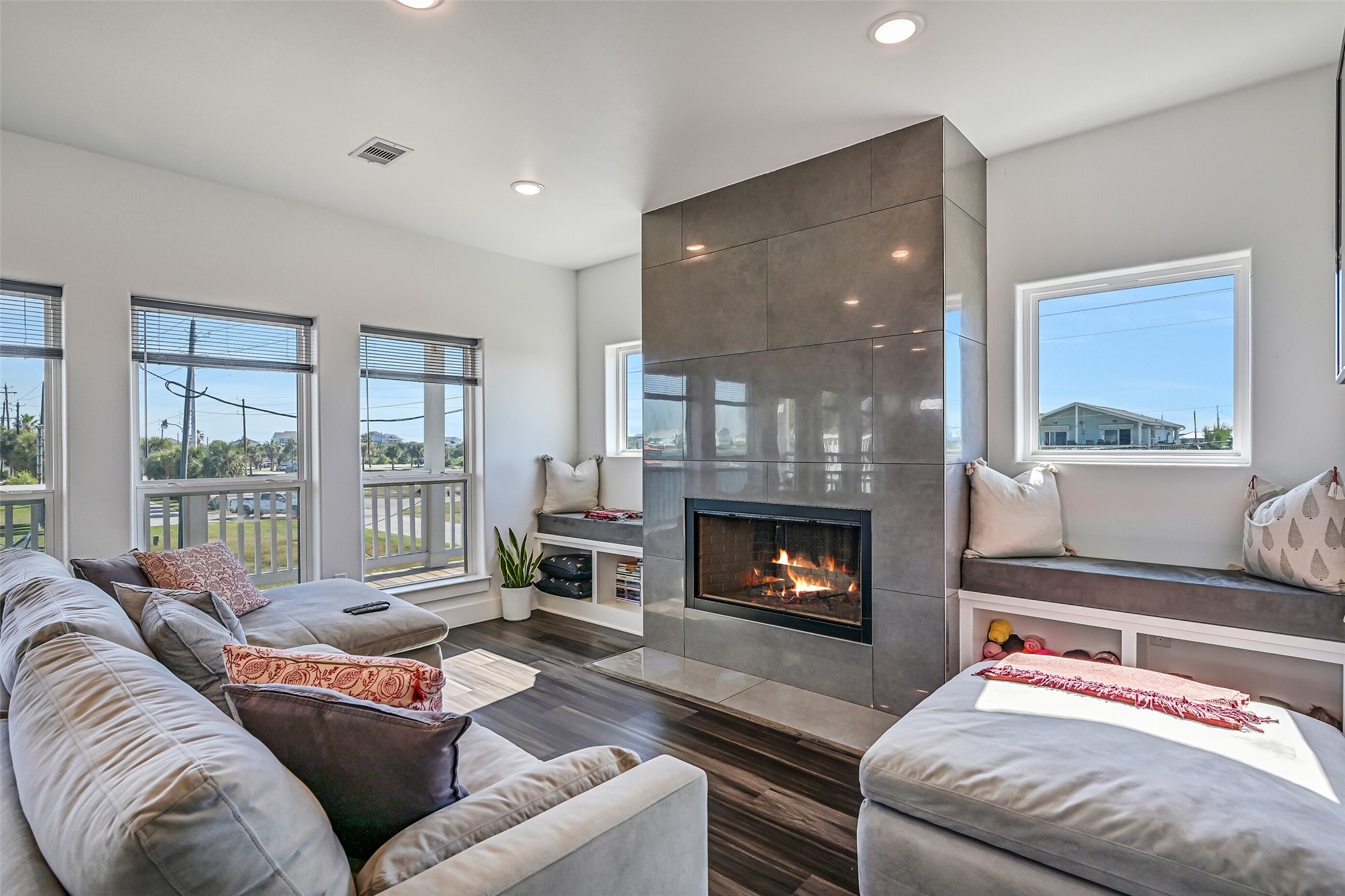 The spacious living room offers the perfect place to unwind or entertain, complete with a cozy wood-burning fireplace.