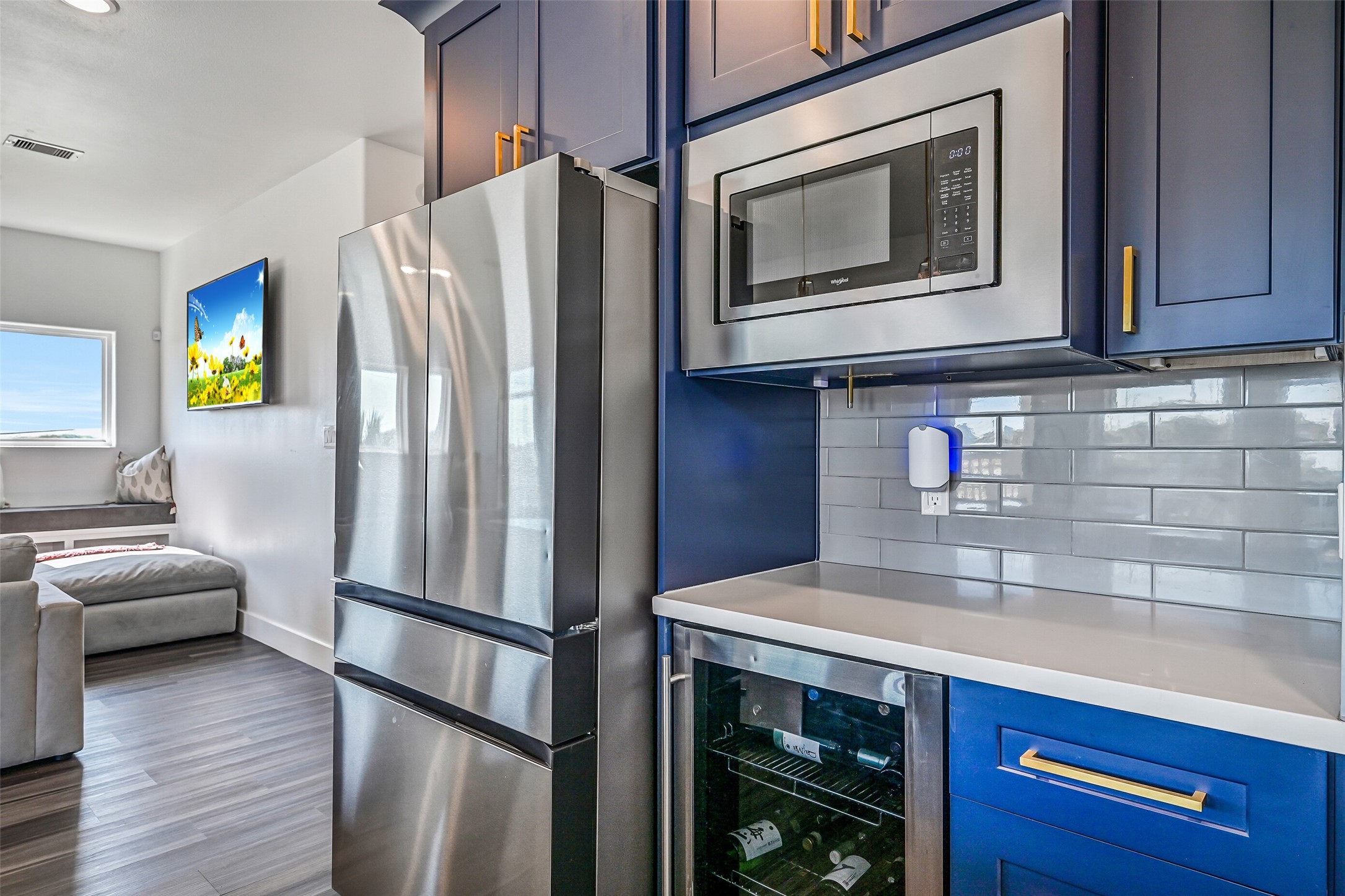 The kitchen also features a wine fridge, Samsung refrigerator, Maytag dishwasher, and Whirlpool microwave.