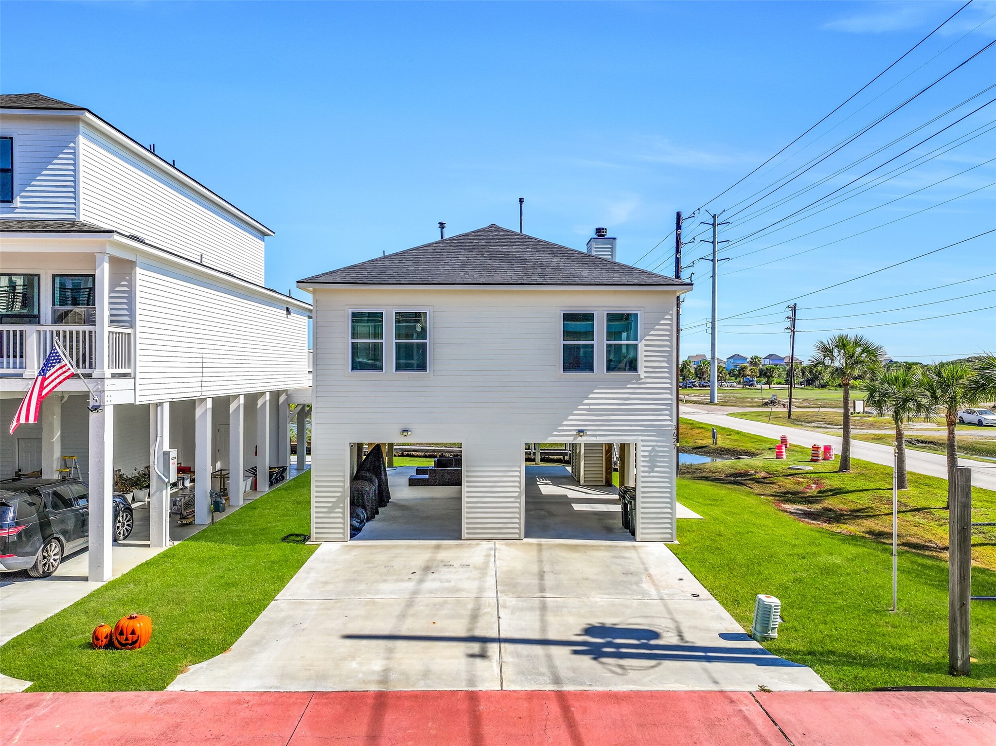 This home boasts a double-wide driveway, additional entertaining space, beautiful Lake Como views, and NO HOA!