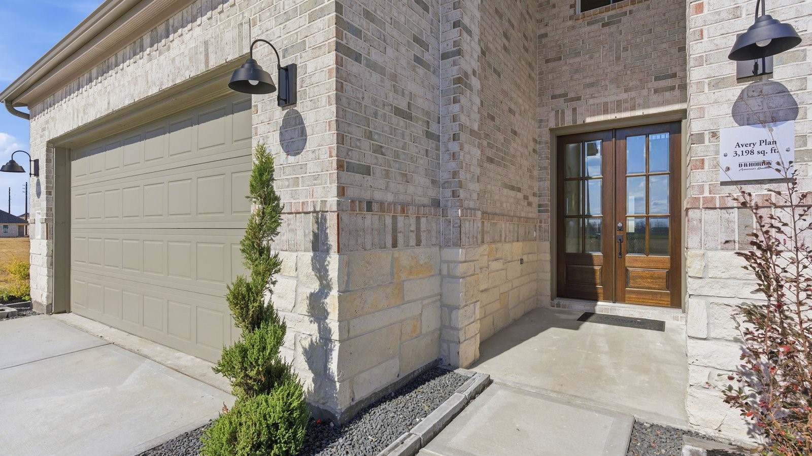 Entry hallway leading to bedrooms and the open concept living and kitchen area.