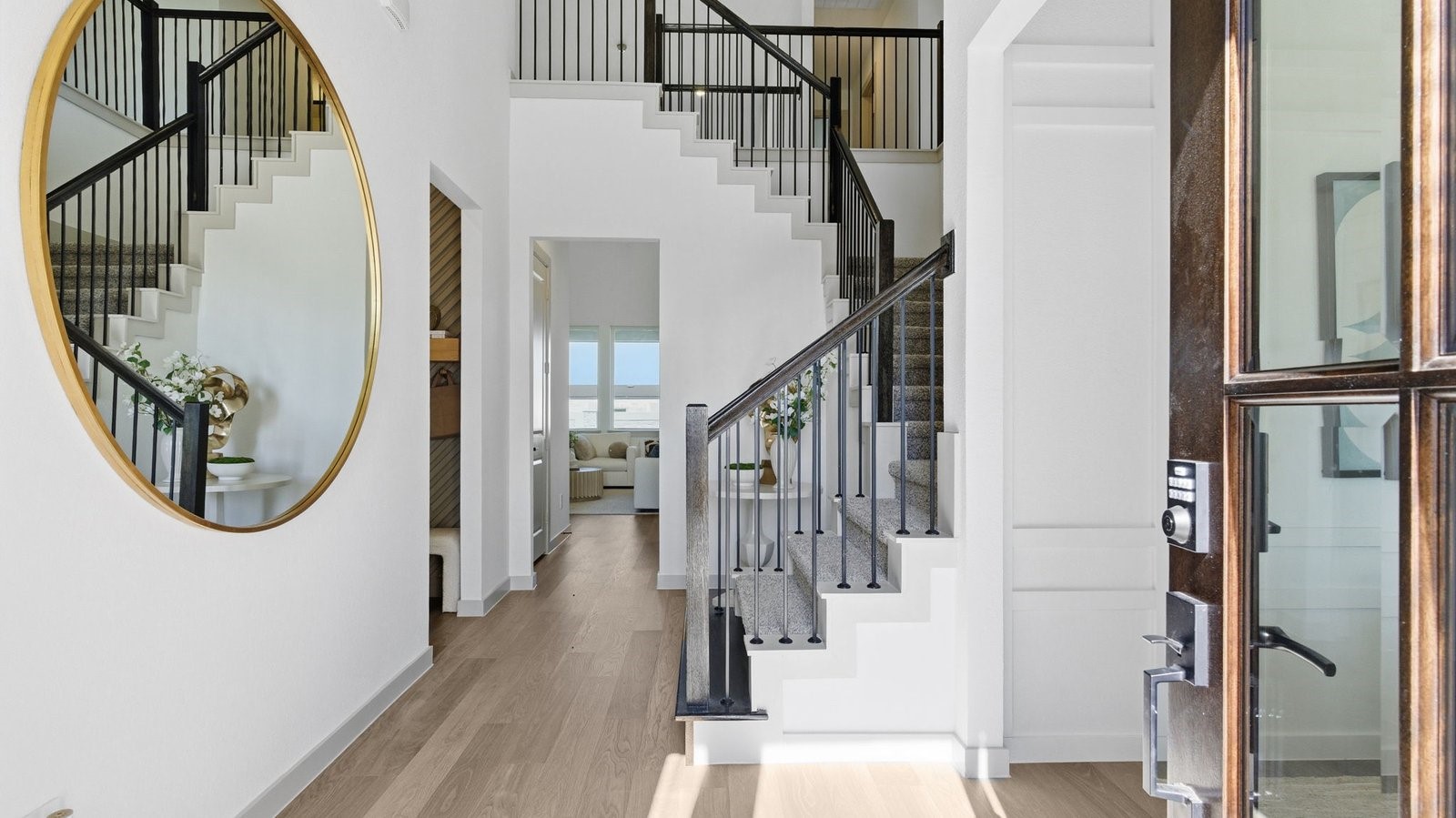 Spacious entry foyer with grand staircase leading to the second floor