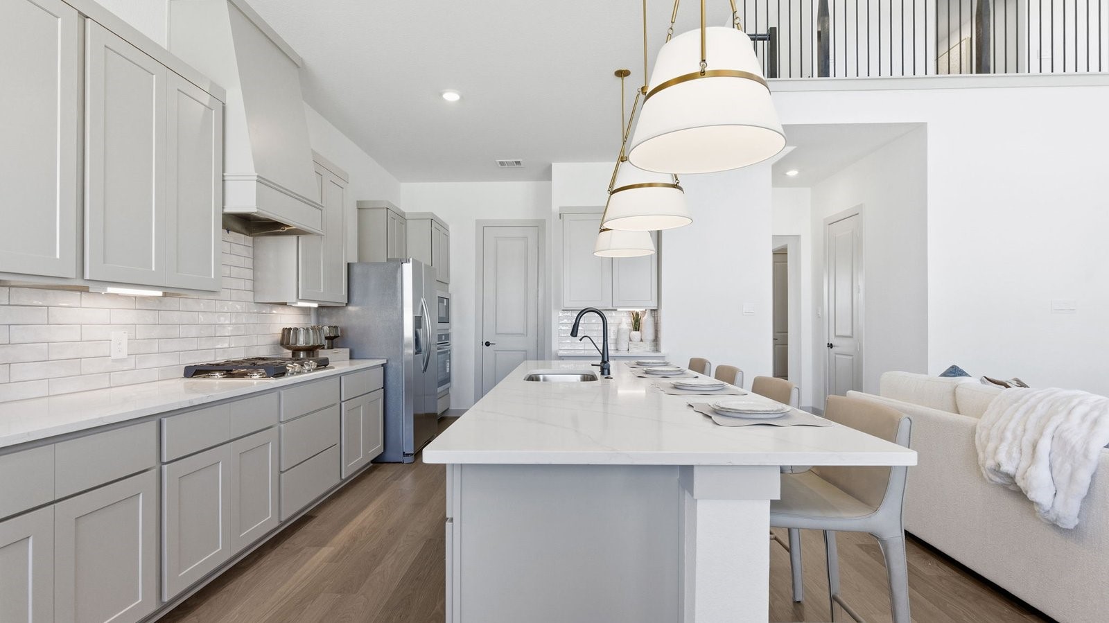 Kitchen adorned with painted cabinets seamlessly integrated into an open dining area layout.