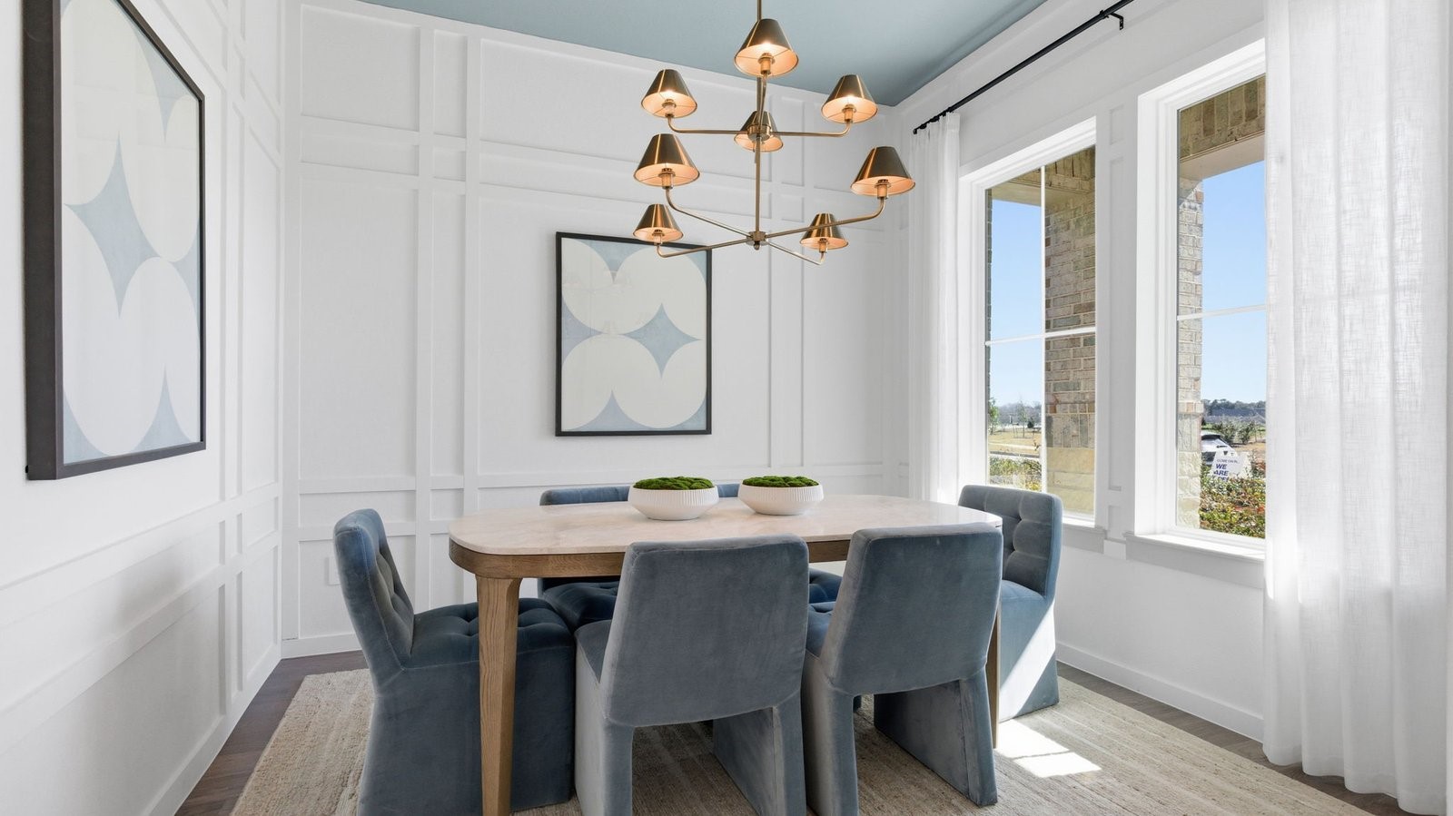 A separate dining room with large windows for maximum natural lighting and a gorgeous view of the front yard