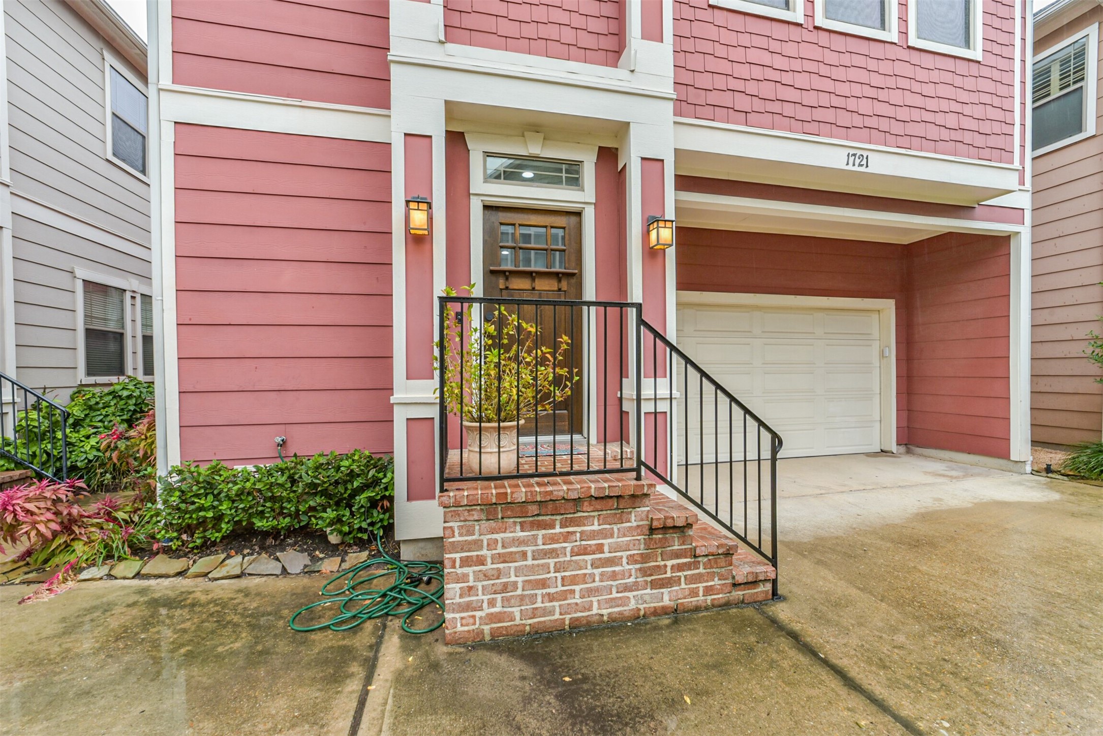 Charming craftsman-style exterior with a freestanding layout, covered entry, and room to play