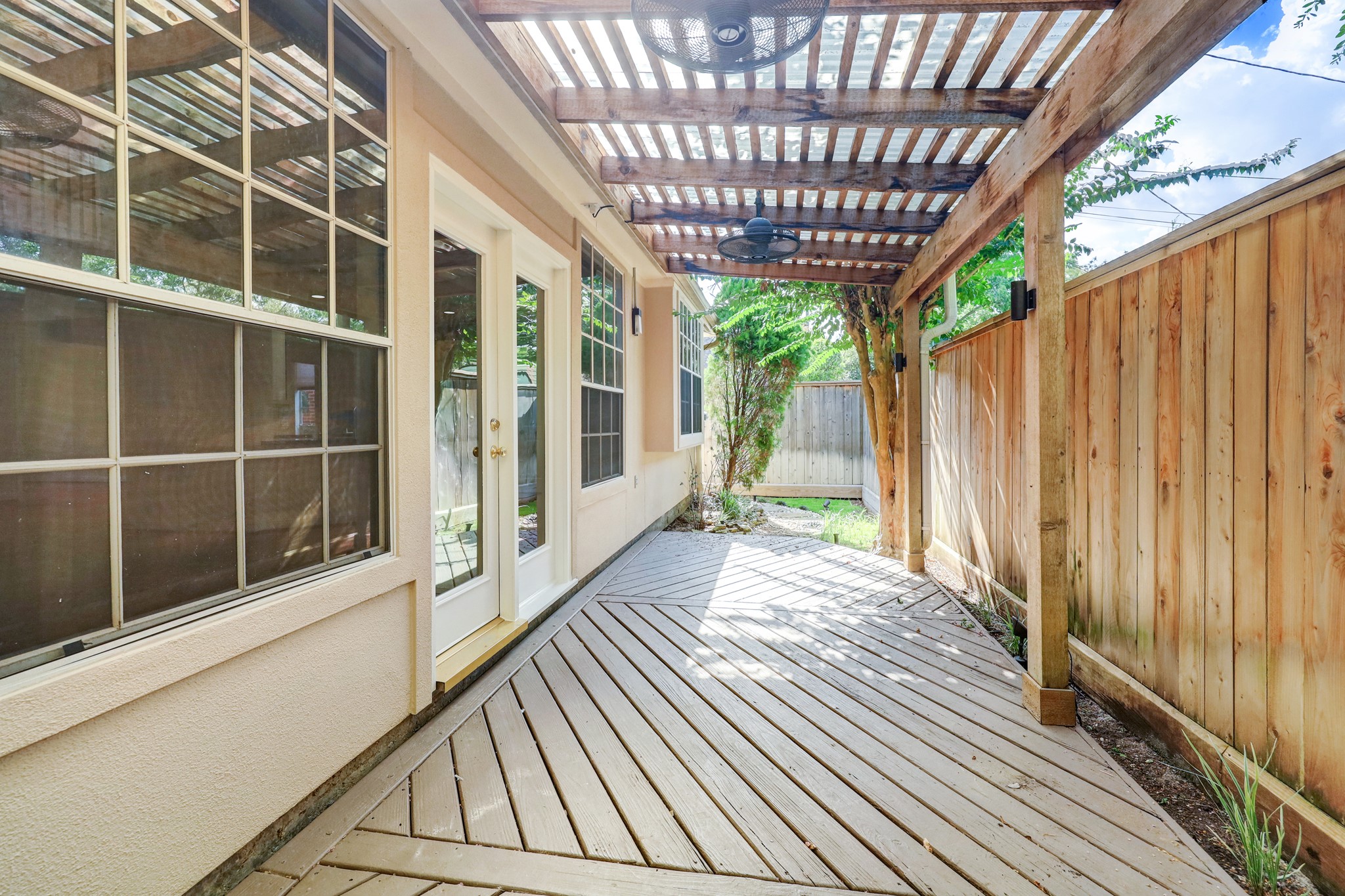 PATIO: A safe and inviting space for kids to play, thanks to gated access and minimal car traffic. Local children often enjoy outdoor play right out front.