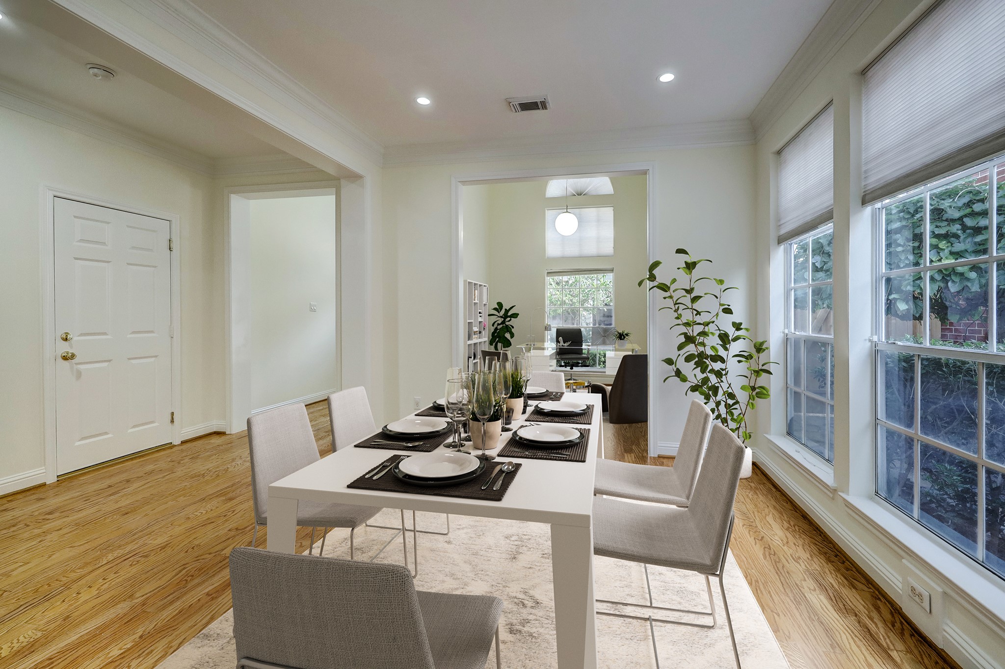 DINING: Located to the left of the entryway, the dining area seamlessly connects to the kitchen. The space is virtually staged to spark inspiration.