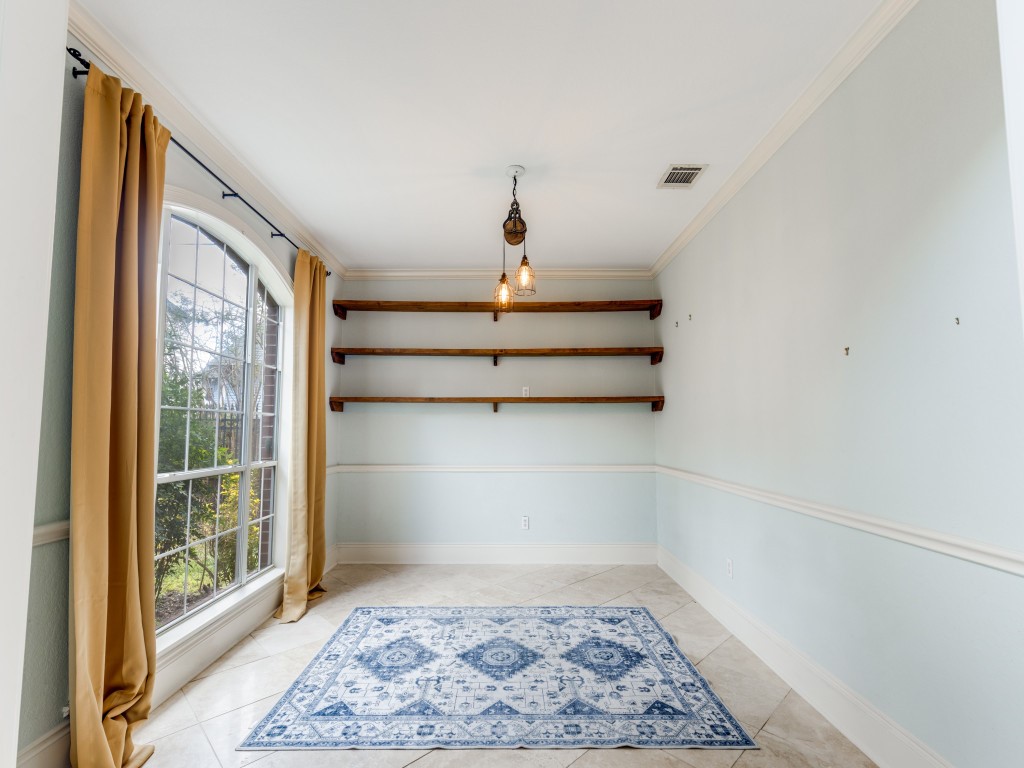 Bright room with large windows and elegant curtains, featuring three wooden shelves on a light blue accent wall. The space includes a stylish hanging light fixture and a patterned area rug on tiled flooring, perfect for a cozy reading nook or home office. Bright room with large windows and elegant curtains, featuring three wooden shelves on a light blue accent wall. The space includes a stylish hanging light fixture and a patterned area rug on tiled flooring, perfect for a cozy reading nook or home office.