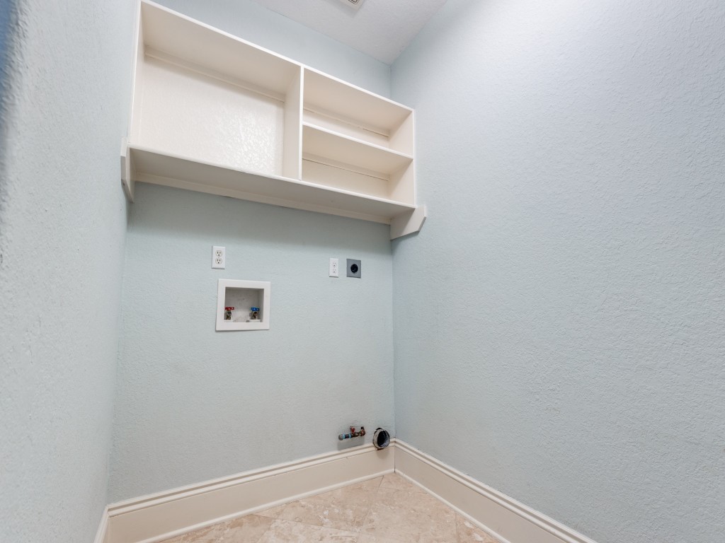 The laundry room connects to the garage for a private entrance to the house.