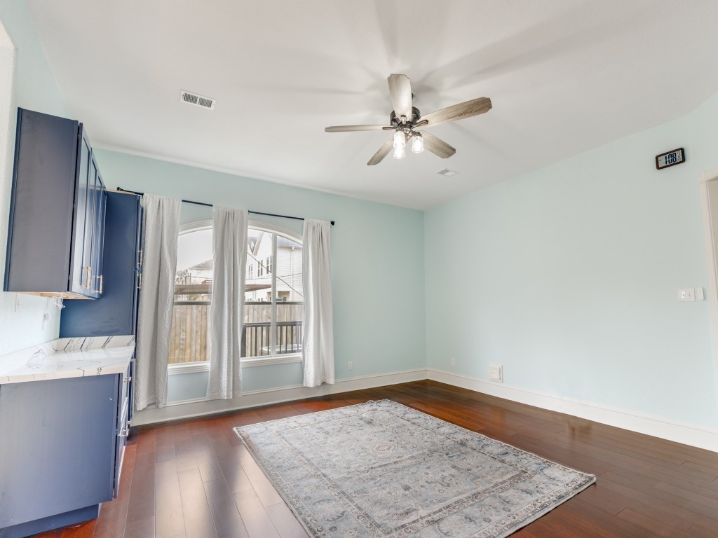 Bright room with hardwood floors. Features a built-in wine bar and wine fridge with cabinets. Ideal space for entertaining. Bright room with hardwood floors. Features a built-in wine bar and wine fridge with cabinets. Ideal space for entertaining.