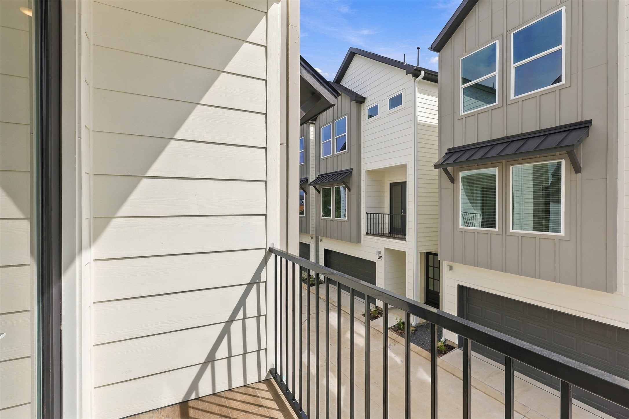 The covered balcony offers a place to step out from the living area.