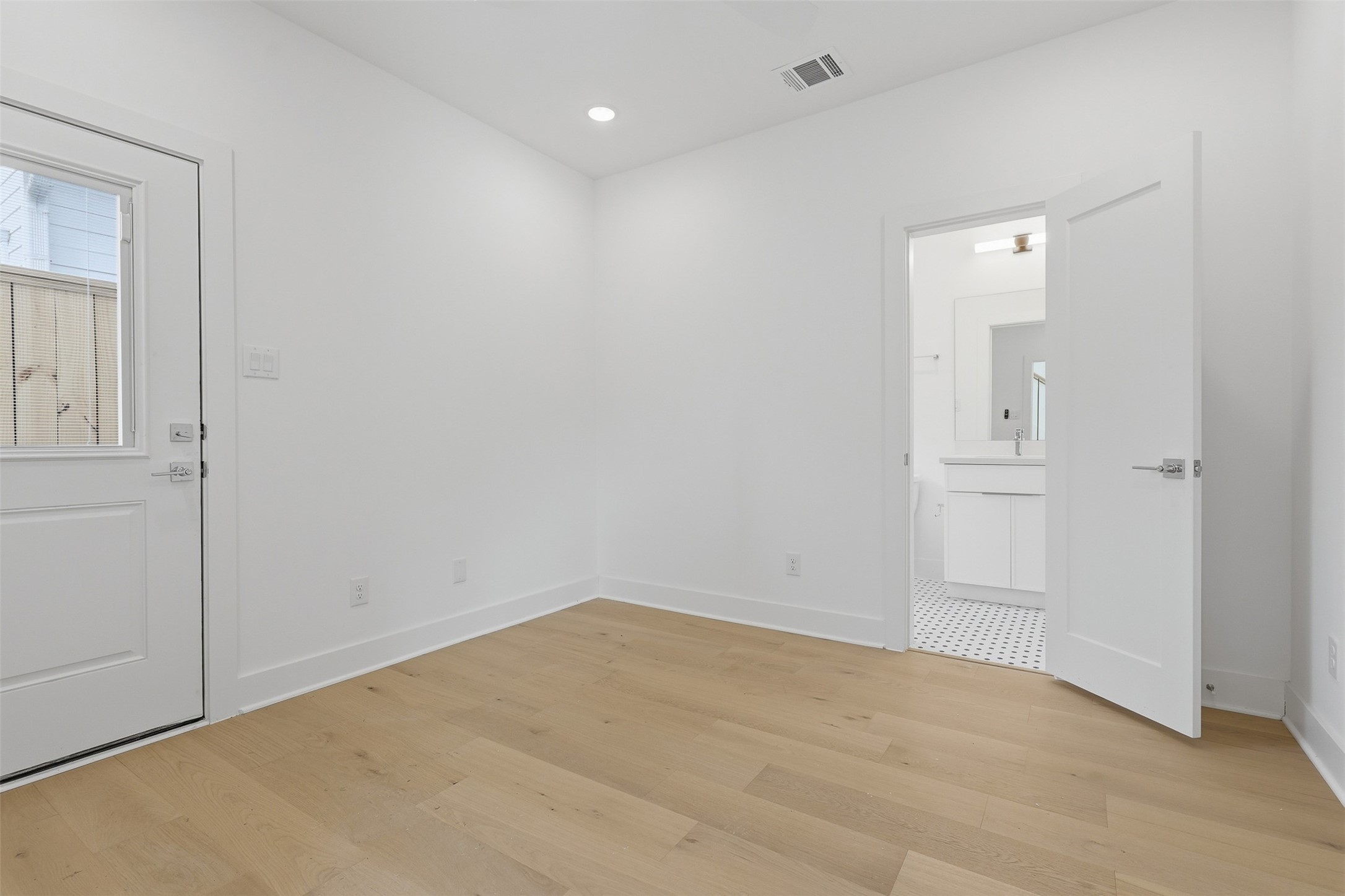 Another bedroom has an adjoining bathroom and its own exterior door.