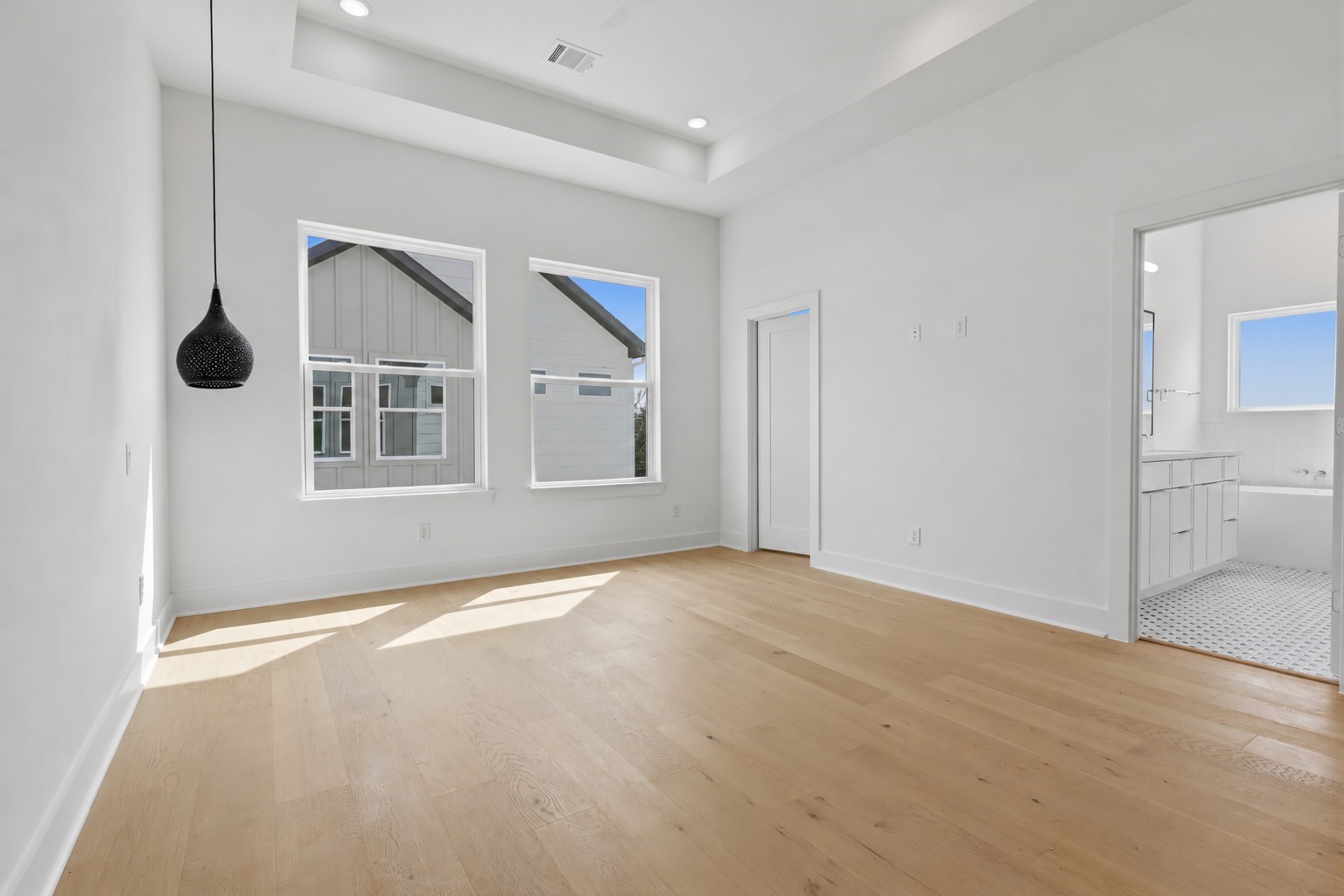 The adjoining bathroom is accessible directly from the bedroom.