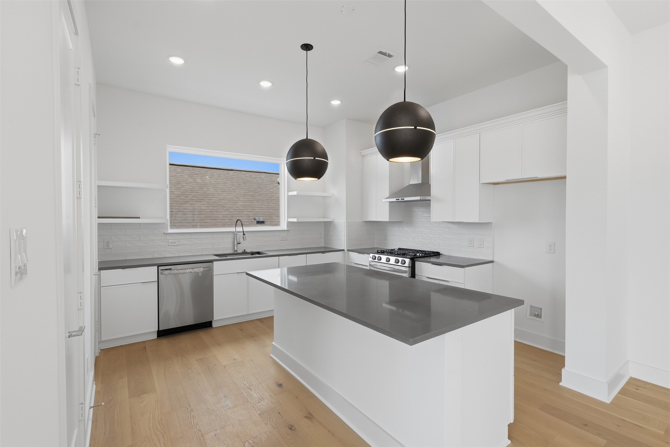 The kitchen island creates a central place for meal preparation and gathering.