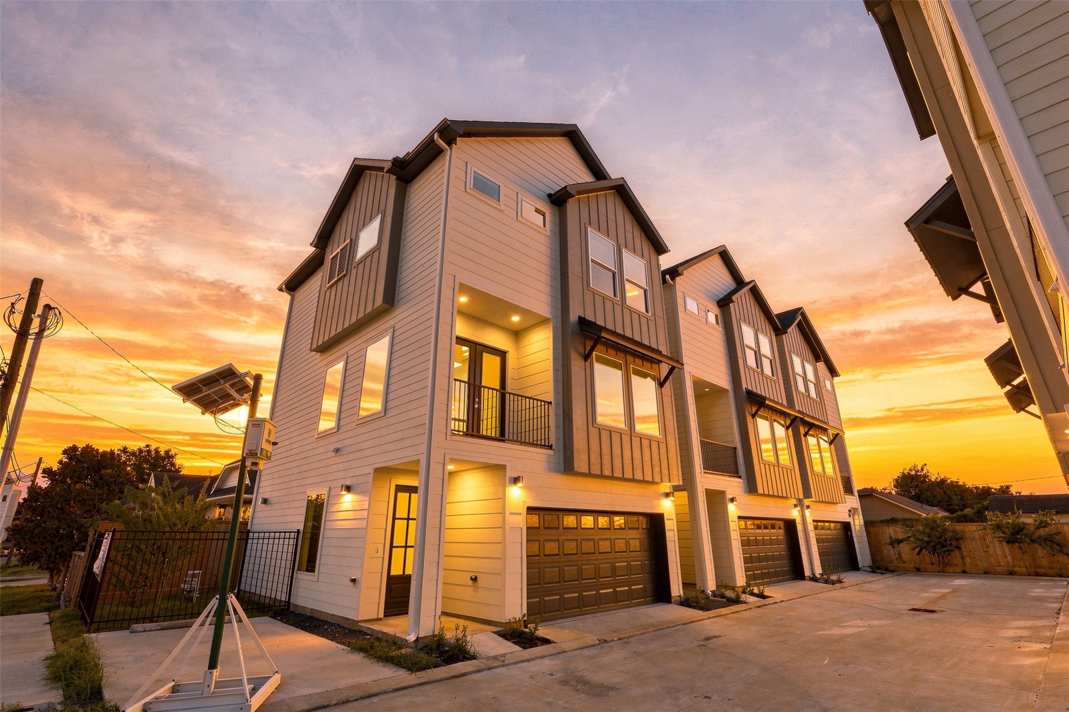 Welcome to 904 Kern St #C, a corner home with an attached garage and covered balcony.architecture with expansive windows and inviting balconies, set against a stunning sunset backdrop. Welcome to 904 Kern St #C, a corner home with an attached garage and covered balcony.architecture with expansive windows and inviting balconies, set against a stunning sunset backdrop.