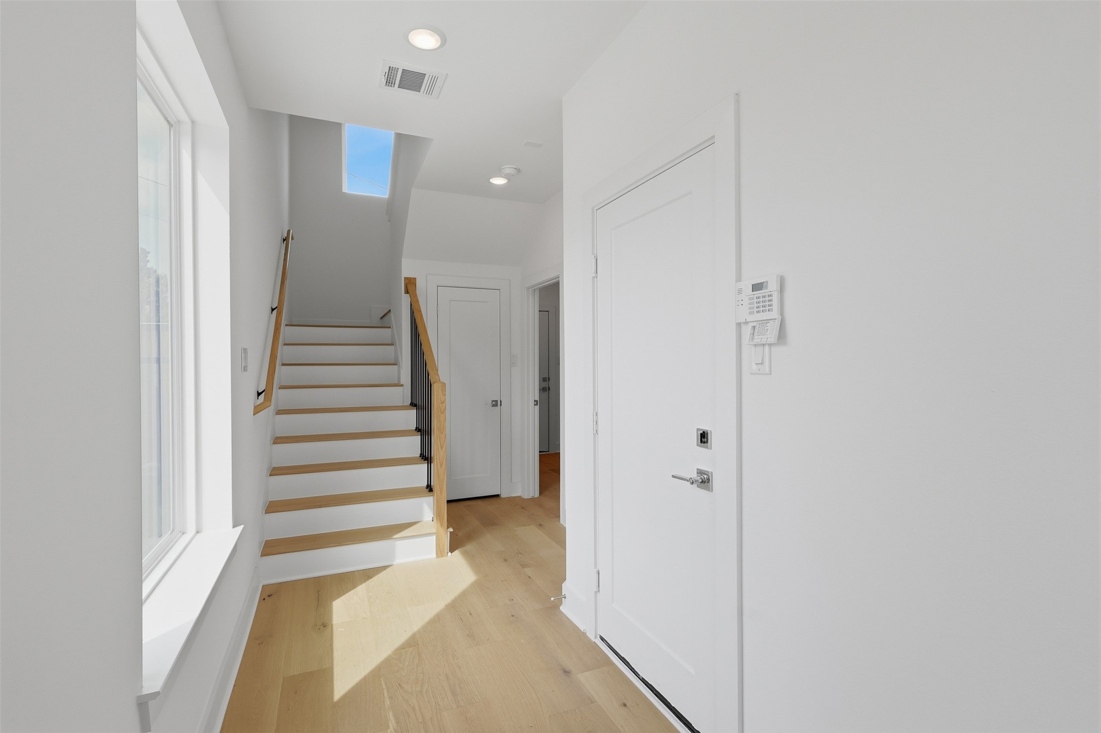 The entry hall connects the lower level to the main living area above.