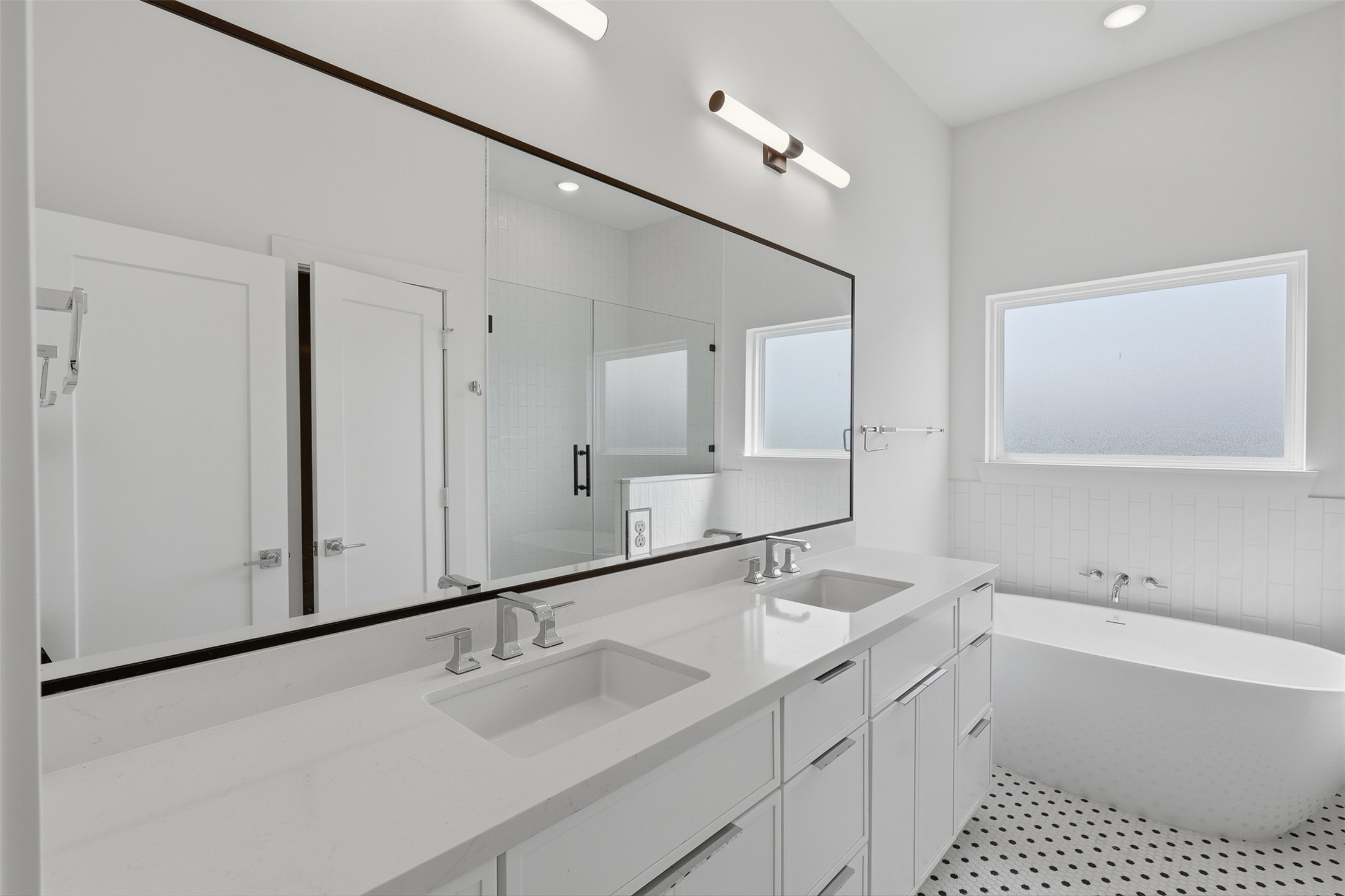 A double vanity provides separate sinks and storage below.