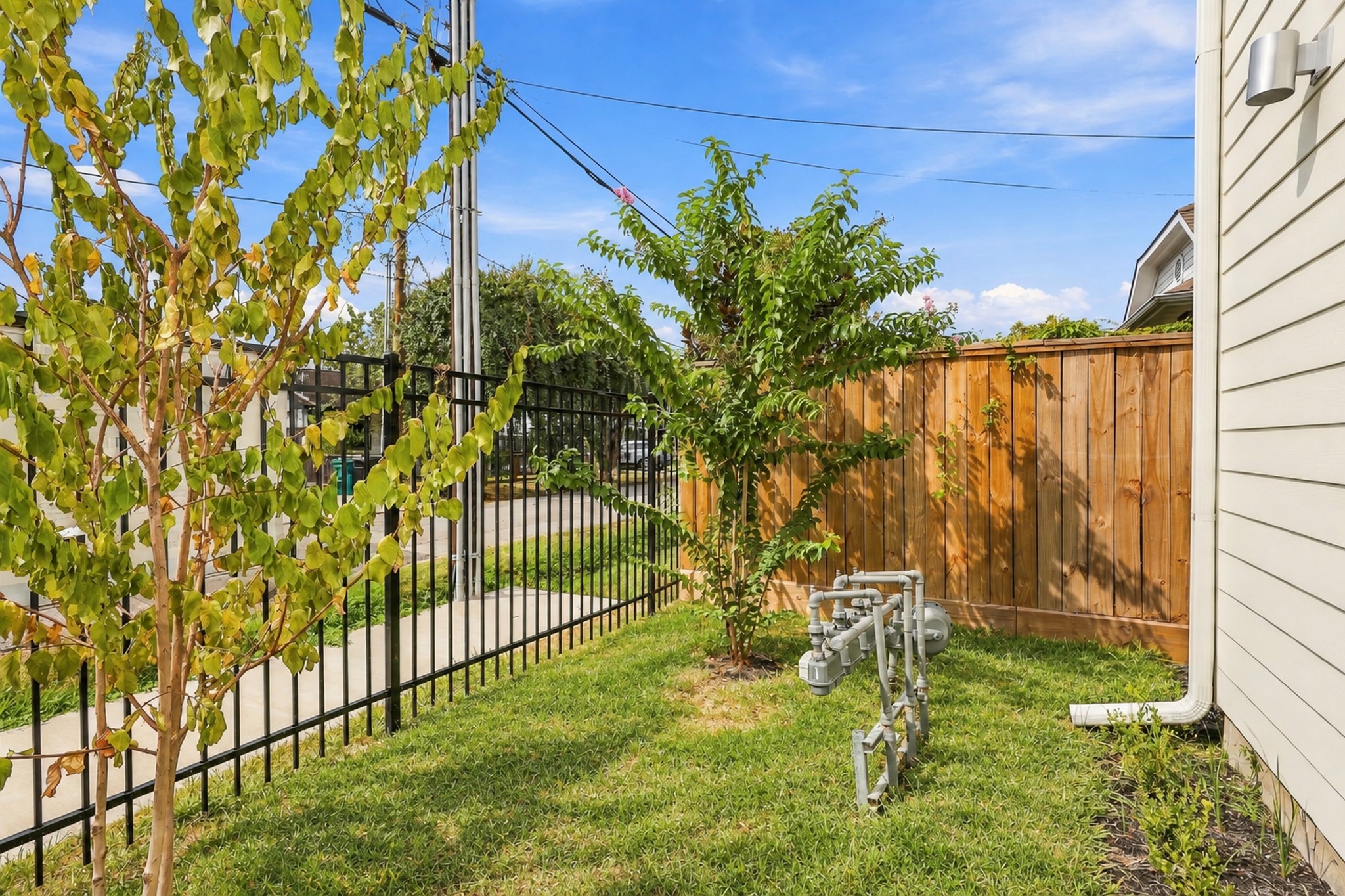 Outside, the fenced side yard gives this corner home a space of its own.